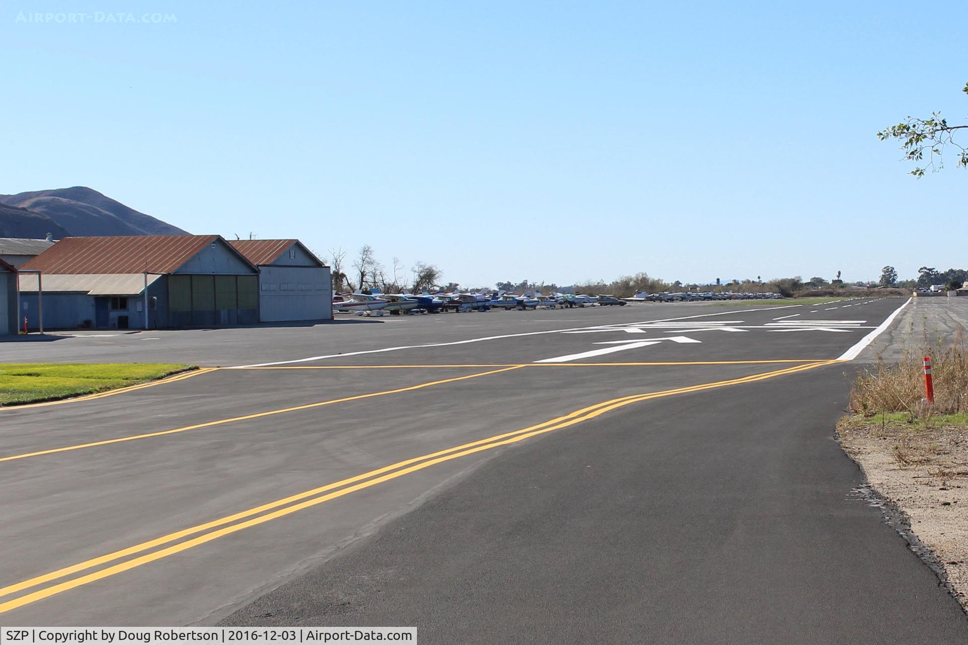 Santa Paula Airport (SZP) - View of Santa Paula's Rwy 22 from behind & from right side of threshold-2,713' x 60' paved, overruns, good condition. No straight-in approaches. Elev. 243' 