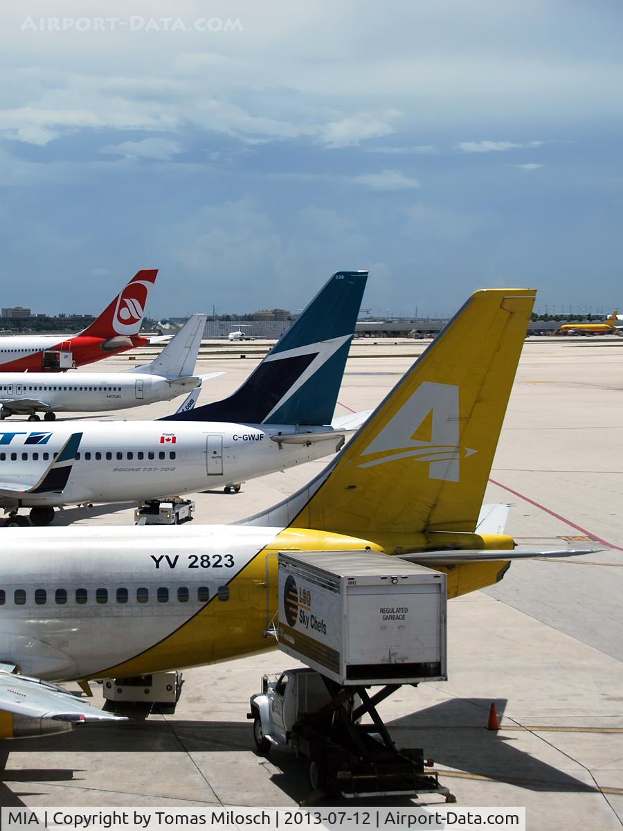 Miami International Airport (MIA) - Very different aircraft at Terminal D