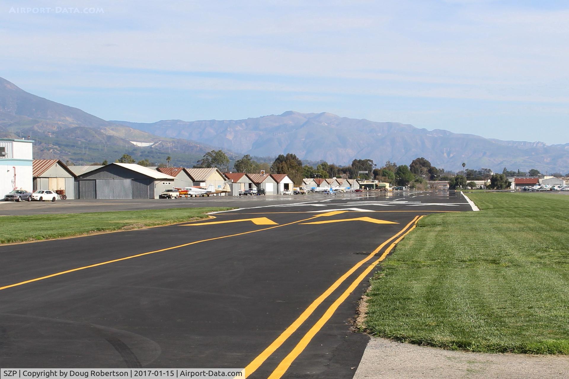 Santa Paula Airport (SZP) - View of Rwy 04 from end right side overrun. 2,713 ft by 60 ft, paved, good condition, Elev, 243'. Use right hand pattern for 04. No straight in approaches. Grass short Runway 04 Right, 22 Left next to paved runway is well kept option for taildraggers.