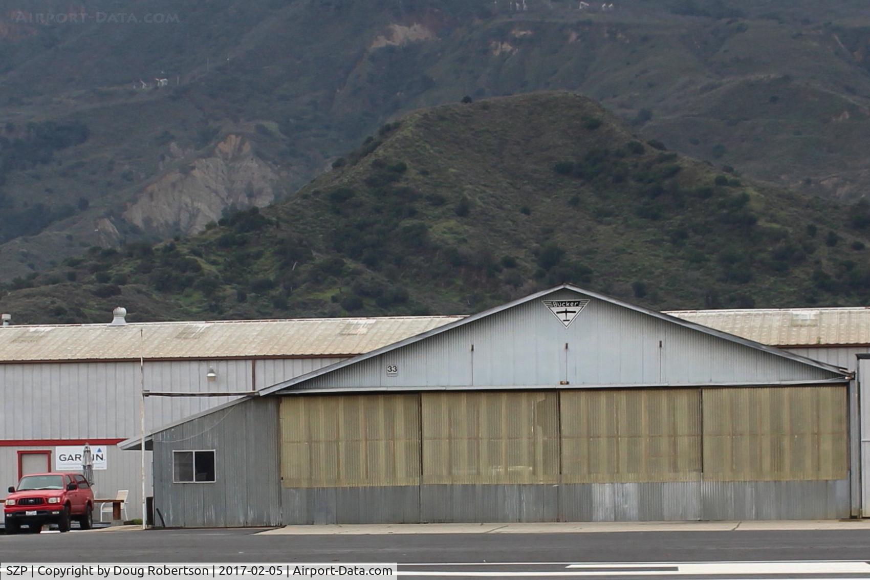 Santa Paula Airport (SZP) - 33 CESSNA TAXI. Another view of Joe Krybus Aviation BUCKER Build Hangar this time also showing his office and entry on left side of Hangar, BU-131 Jungmanns & BU-133 Jungmeisters built/maintained/repaired here.