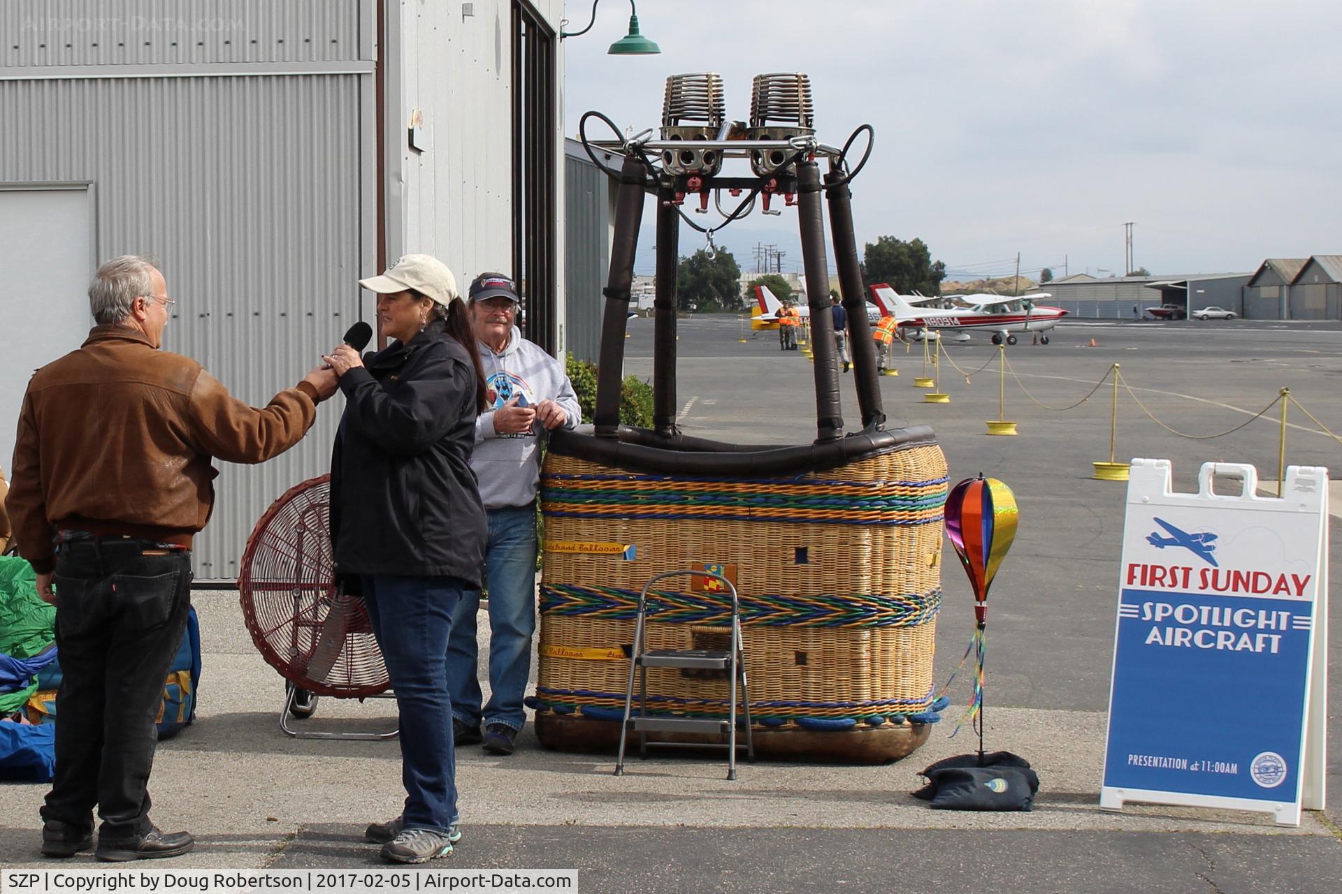 Santa Paula Airport (SZP) - Santa Paula Airport Aviation Museum Featured Aircraft-N157LB 2001 Lindstrand 90A HOT AIR BALLOON *Starlite*, Moderator David Watson with lady owner/pilot comments on the balloon operation/functioning. She also Chairwoman of local 99s.