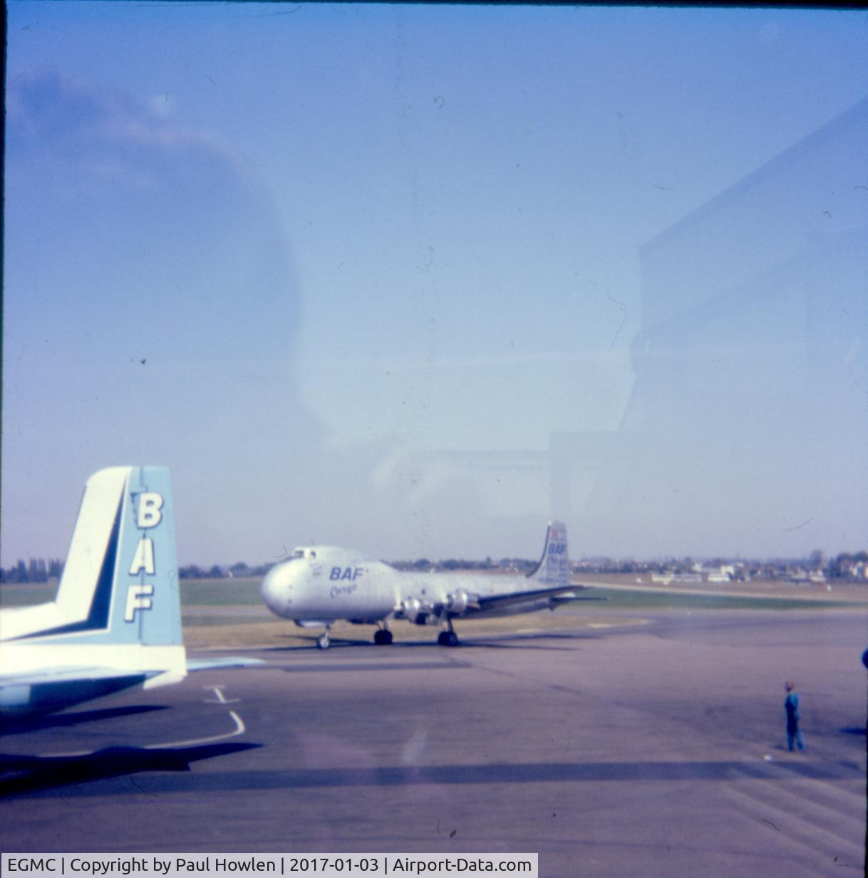 London Southend Airport, Southend-on-Sea, England United Kingdom (EGMC) - Southend Apron scene C.1976 with G-ASDC 'Plain Jane' and tail of Handley Page Herald 