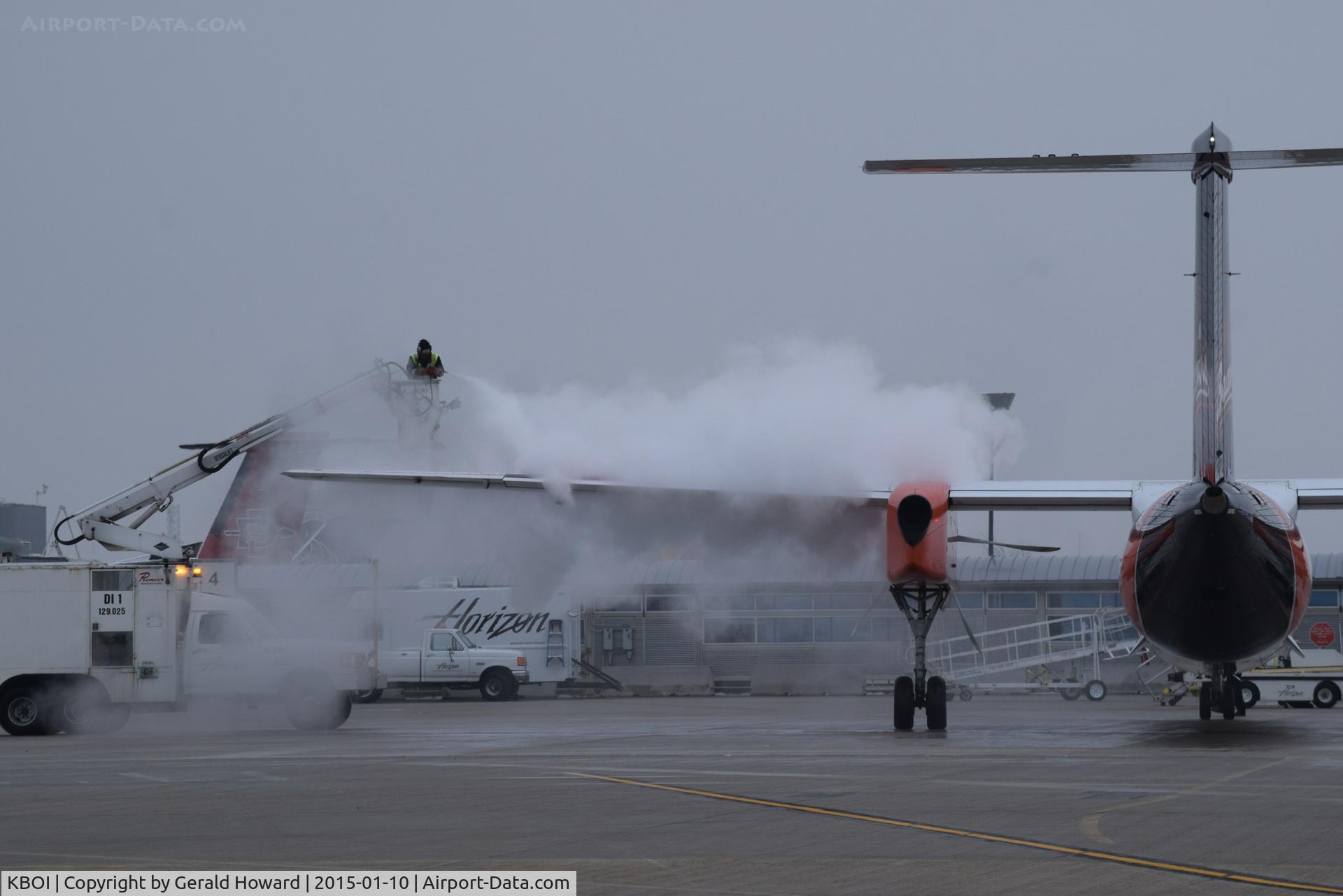 Boise Air Terminal/gowen Fld Airport (BOI) - De ice in progress on the Alaska/Horizon ramp.