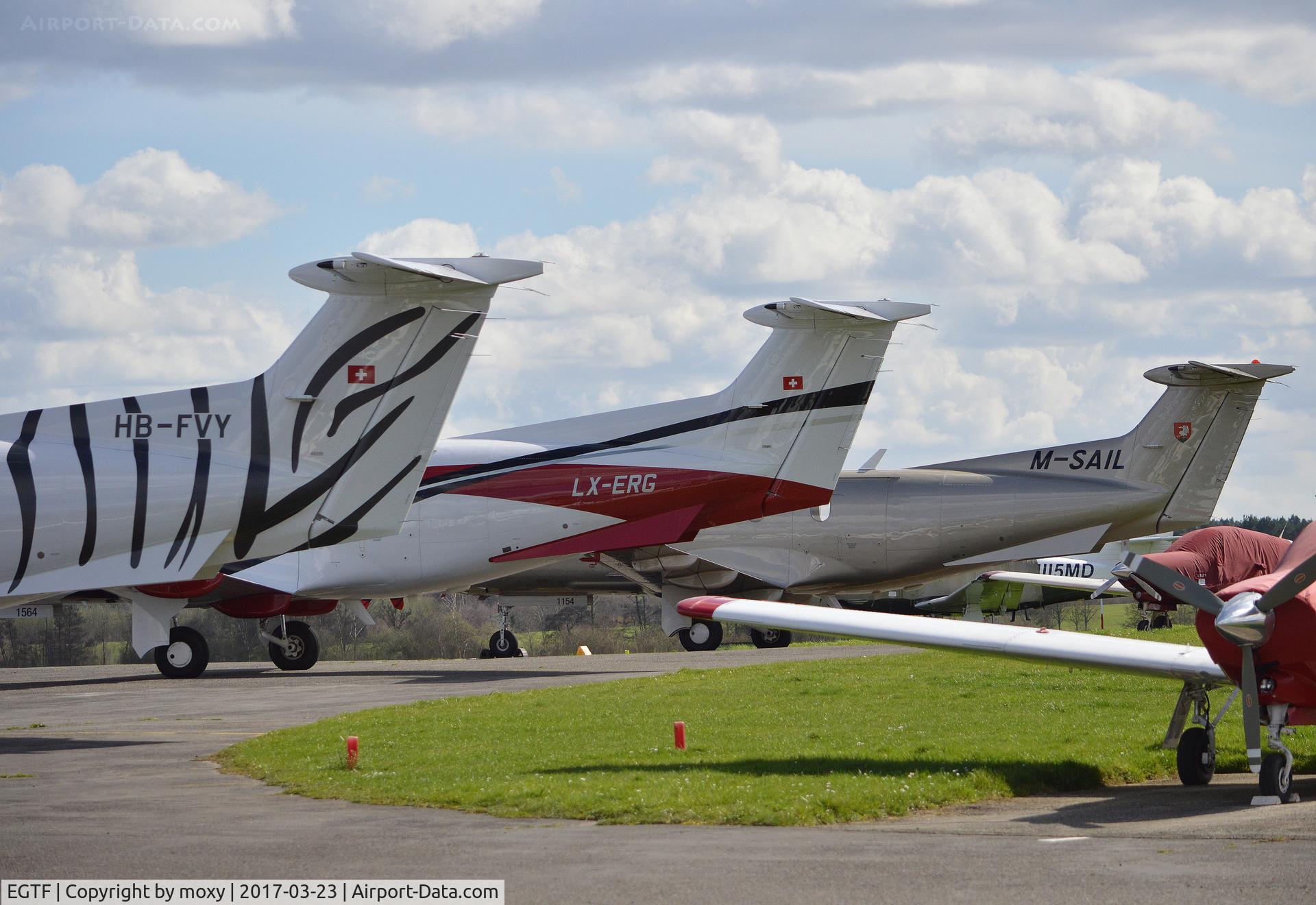 Fairoaks Airport, Chobham, England United Kingdom (EGTF) - A trio of Pilatus PC12s at Fairoaks.