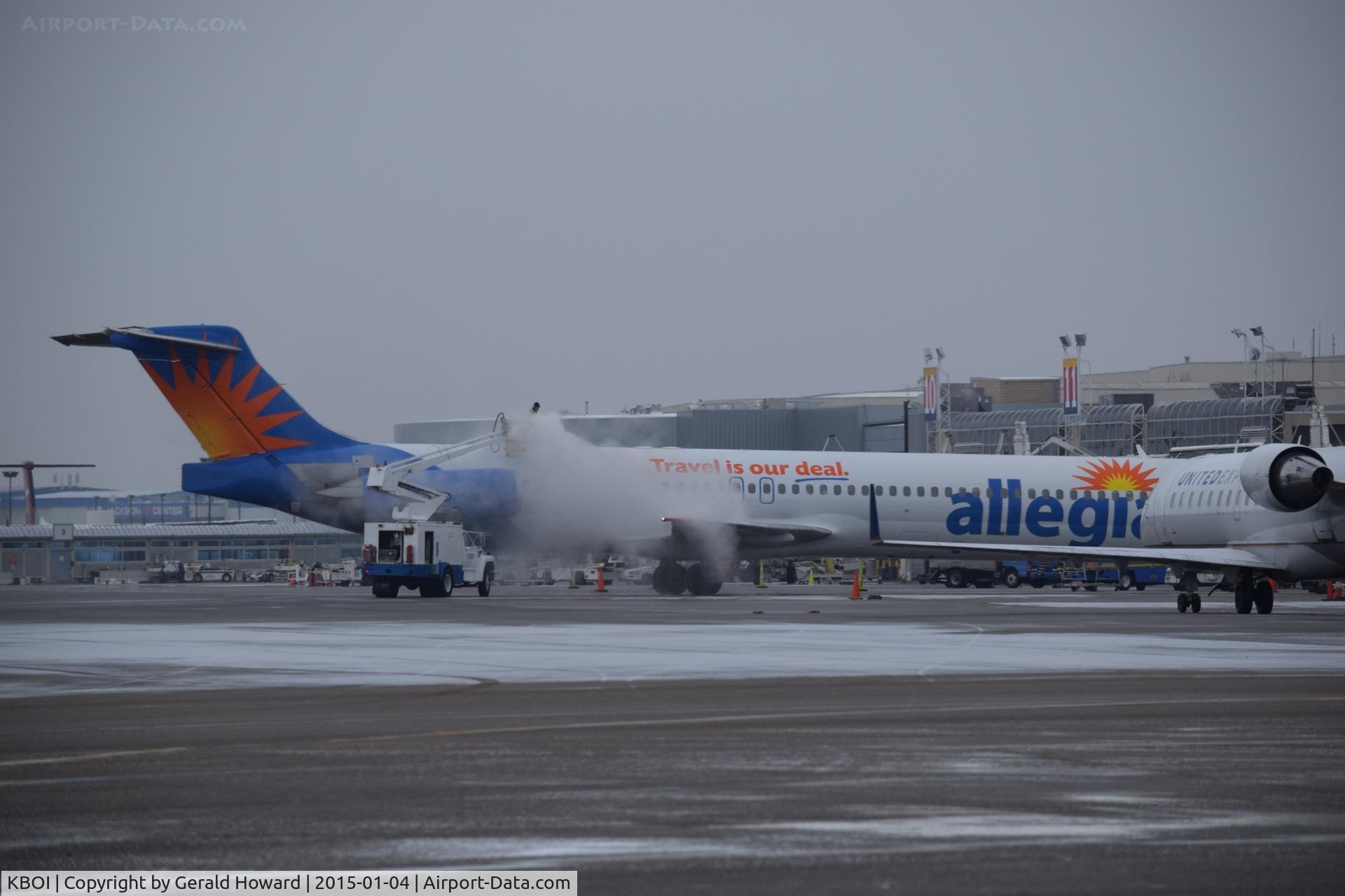 Boise Air Terminal/gowen Fld Airport (BOI) - De ice operations during a cold, snowy morning.