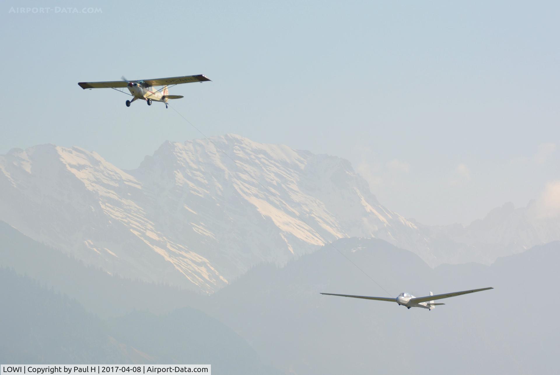 Innsbruck Airport, Innsbruck Austria (LOWI) - Towing a glider out off LOWI, Innsbruck with the austrian alps in the background