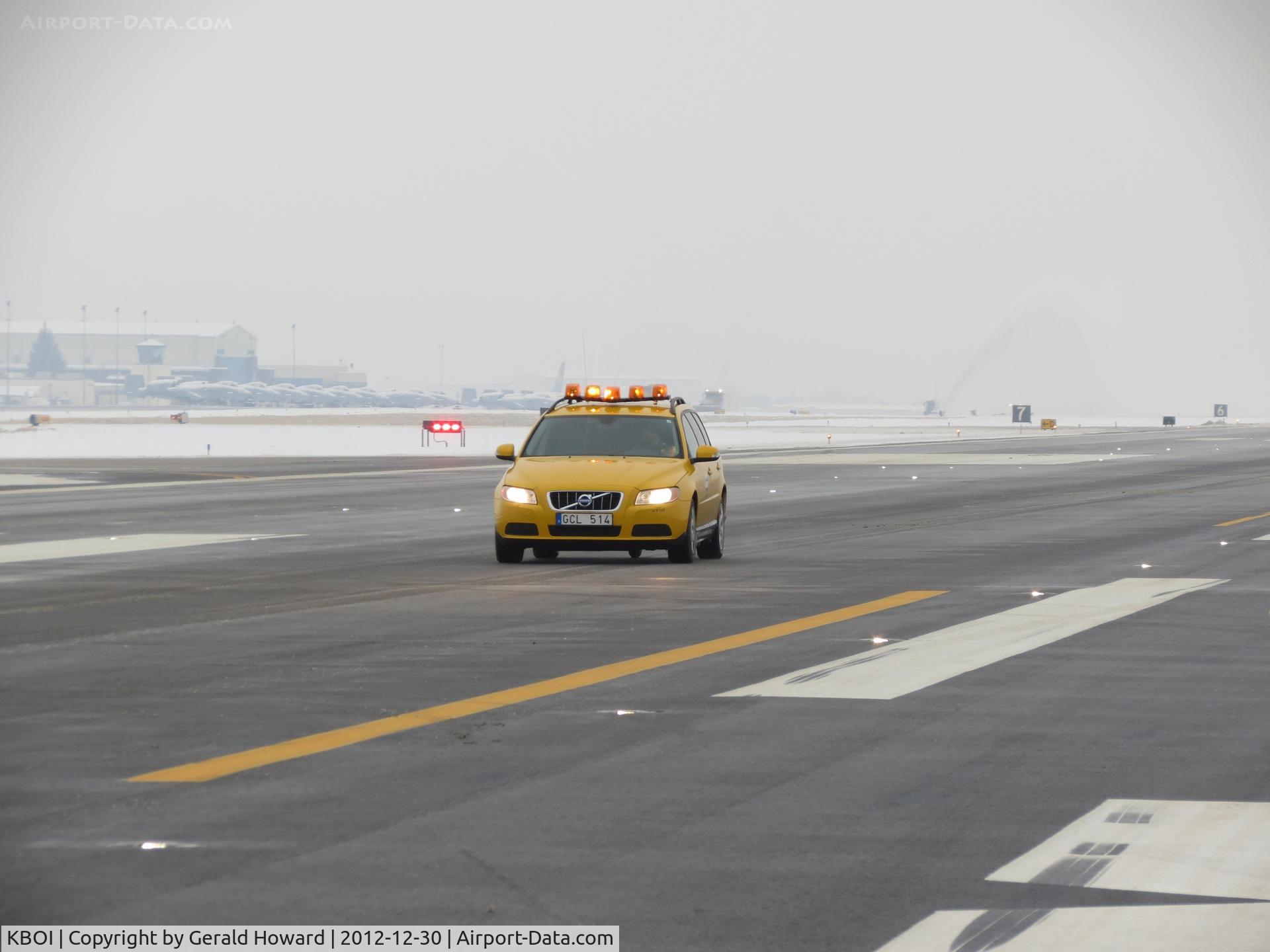 Boise Air Terminal/gowen Fld Airport (BOI) - Volvo friction car at work. Vehicle has a 5th wheel between the axels and a computer to determine runway friction values during snow removal.