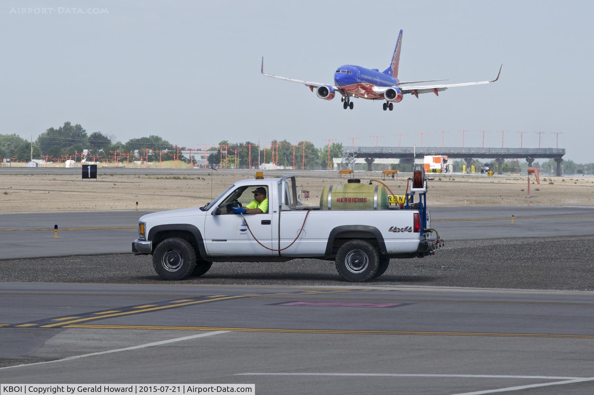 Boise Air Terminal/gowen Fld Airport (BOI) - Outside maintenance crews spraying to keep the weeds at bay. A never ending job.