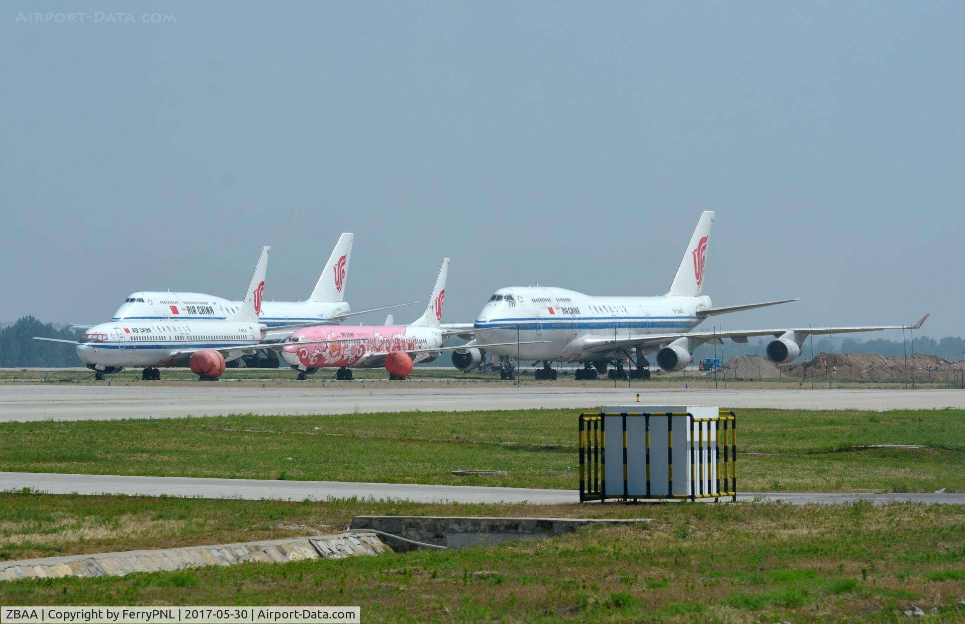 Beijing Capital International Airport, Beijing China (ZBAA) - Corrosion corner PEK with a B748 passing behind it.