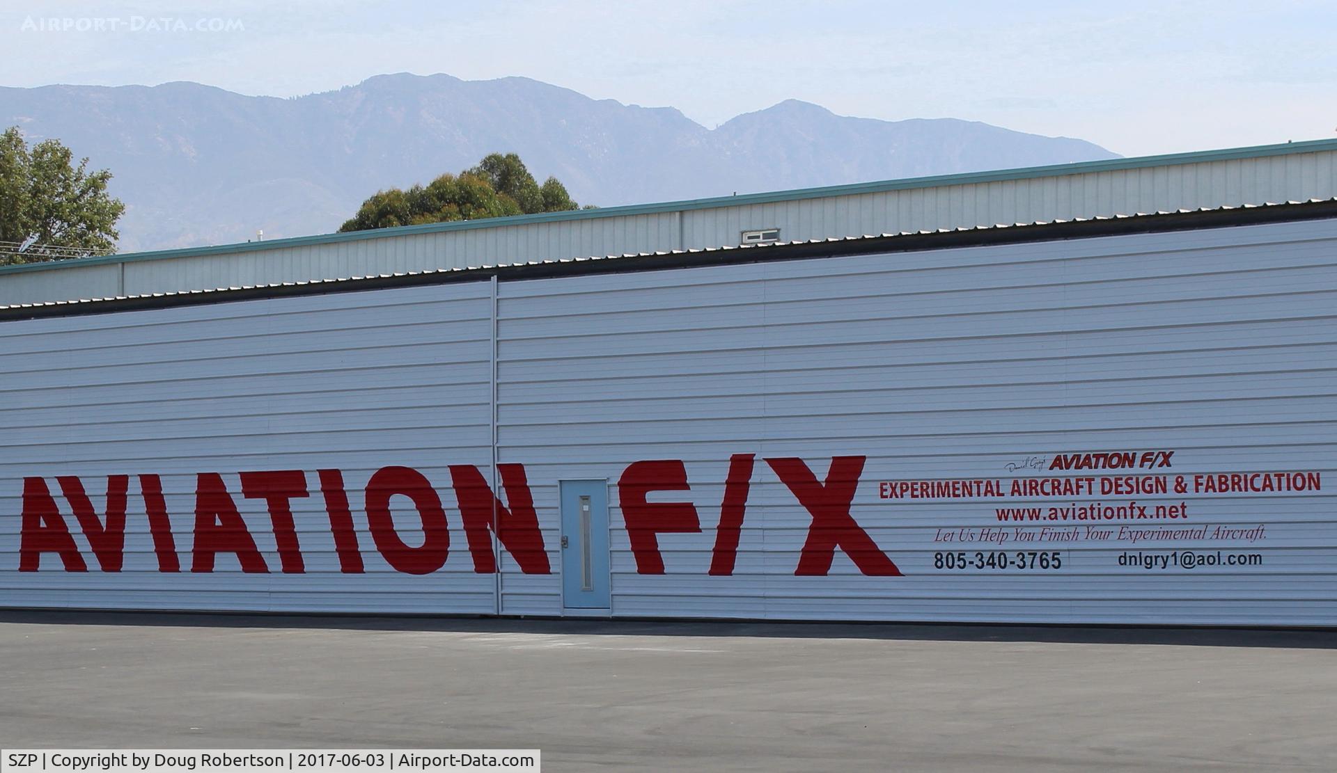 Santa Paula Airport (SZP) - AVIATION F/X has designed, built, modified, improved, or otherwise finished over fifty varied Experimental Aircraft airworthy completions. New sign on their repainted huge hangar. 