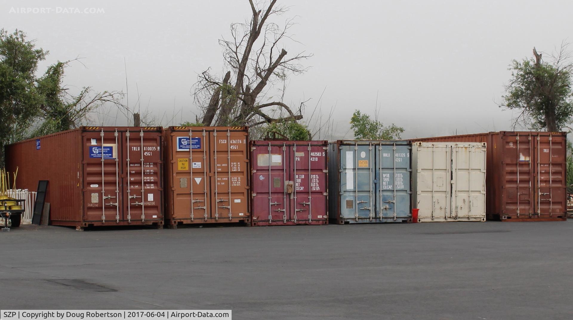 Santa Paula Airport (SZP) - RAY'S Aviation at SZP does good business disassembling/packing aircraft for overseas buyers or receiving bought foreign aircraft for reassembly-uses these Ocean Freight Shipping Containers.