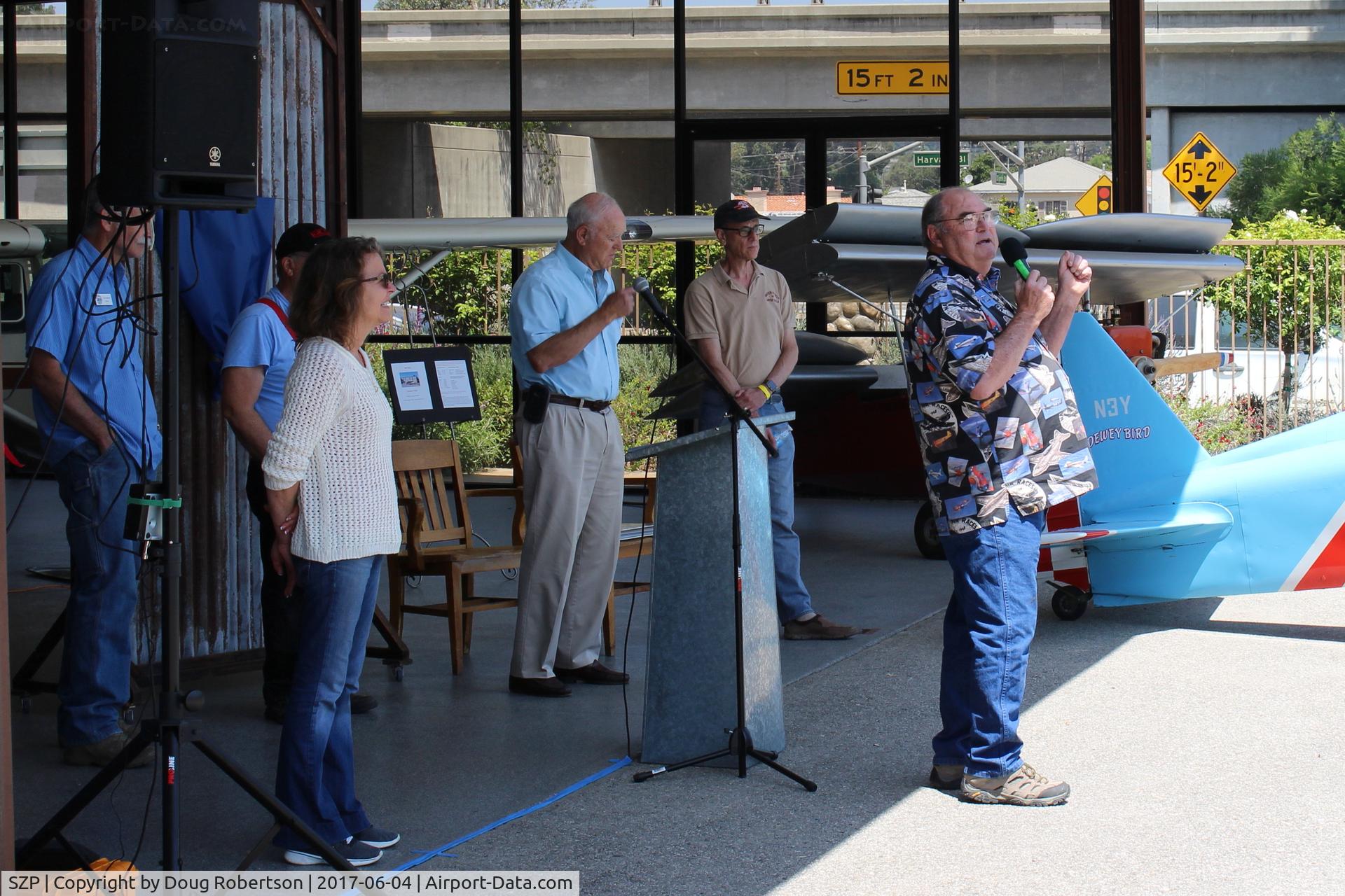 Santa Paula Airport (SZP) - Bruce Dickenson announcing purchase/dedication of Hangar ONE (behind him) for the Aviation Museum of Santa Paula. His pilot father in 1930 one of the 16 airport founders. Cake was served.