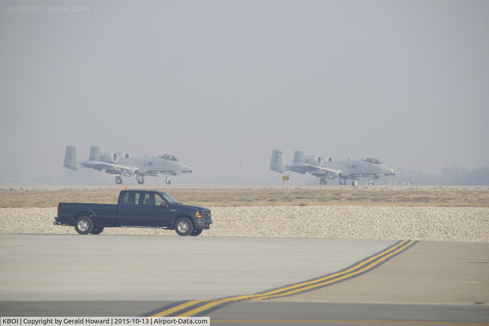 Boise Air Terminal/gowen Fld Airport (BOI) - A-10s lined up on RWY 10R for take off. Smoke filled IFR day.