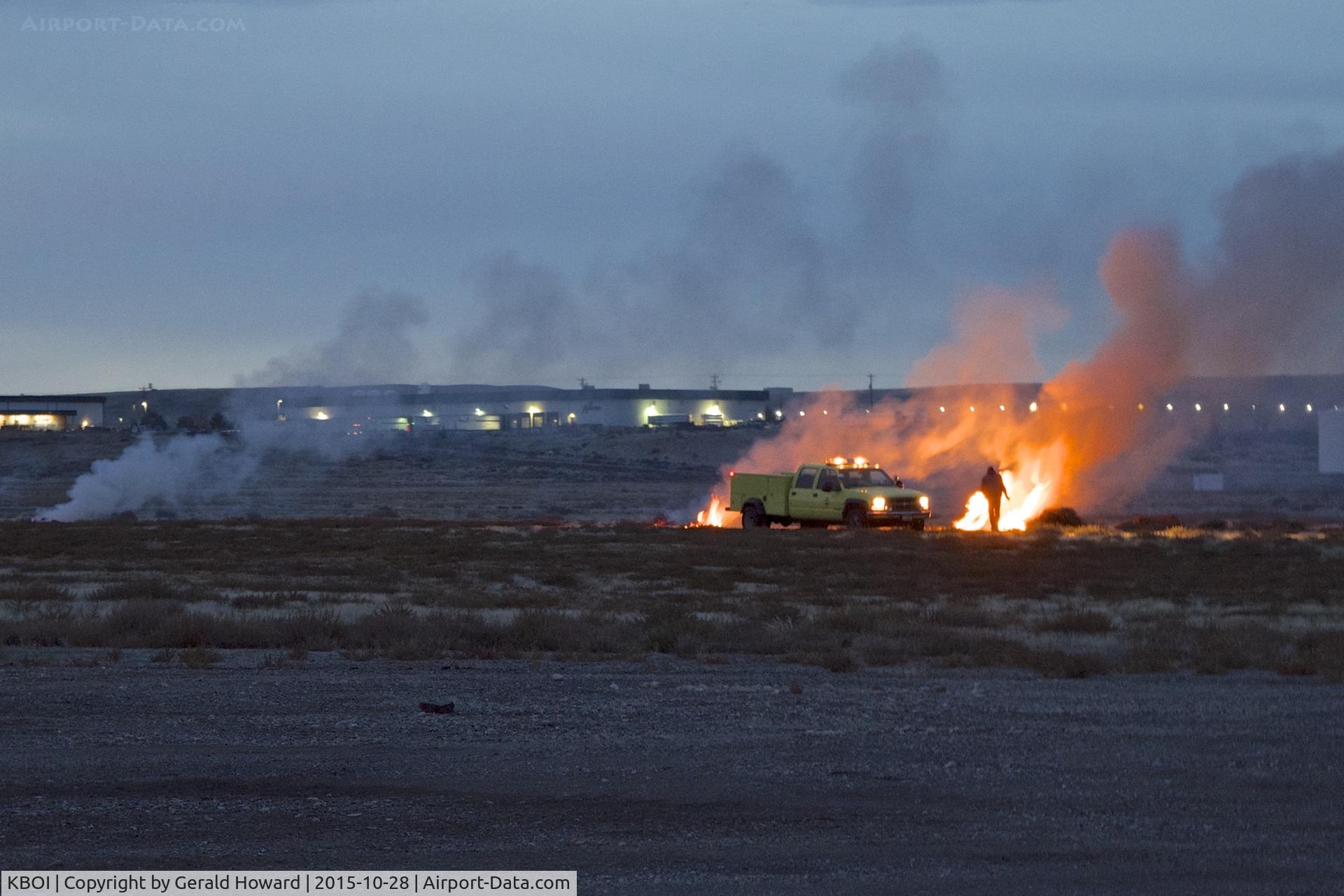 Boise Air Terminal/gowen Fld Airport (BOI) - Early morning burning of piles of tumbleweeds that collect on the airport. When the wind blows they become a FOD hazard.