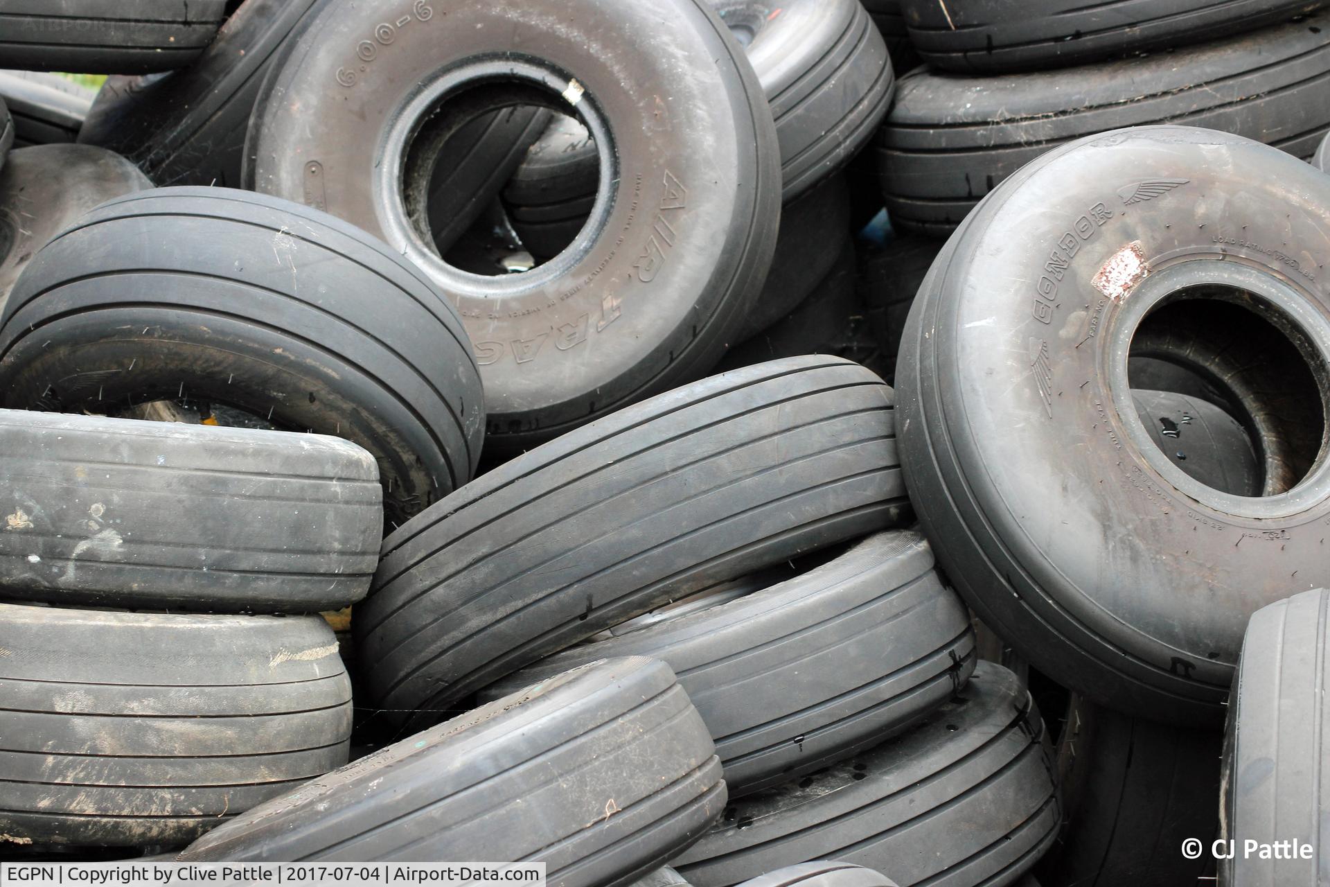 Dundee Airport, Dundee, Scotland United Kingdom (EGPN) - Looking tired at Dundee. A pile of discarded aircraft tyres await recycling at Dundee EGPN.
