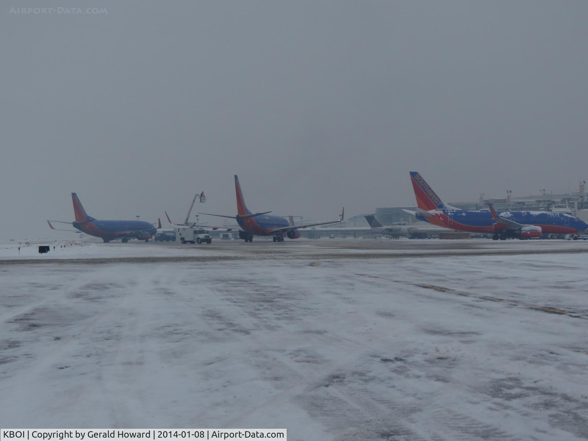 Boise Air Terminal/gowen Fld Airport (BOI) - 3 Southwest jets getting a second de ice before take off.