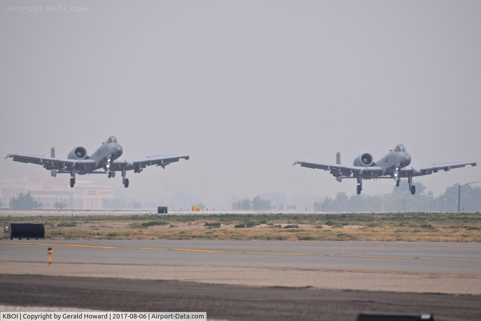 Boise Air Terminal/gowen Fld Airport (BOI) - Two A-10Cs from the 190th Fighter Sq., Idaho ANG making a formation landing on a 4 mile vis, smoky day.