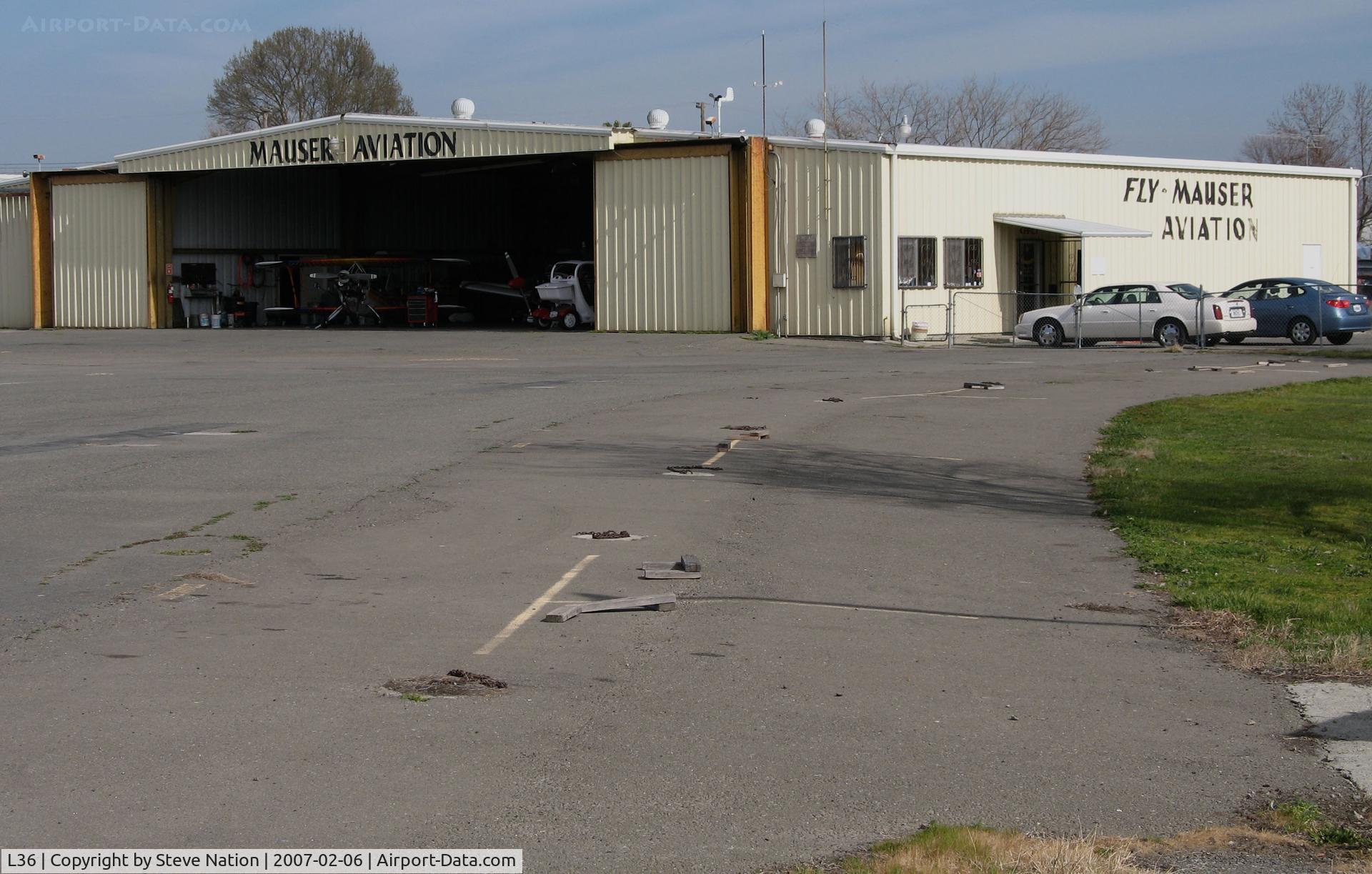 Rio Linda Airport (L36) - Mauser Aviation hangar and ramp @ Rio Linda Airport, CA