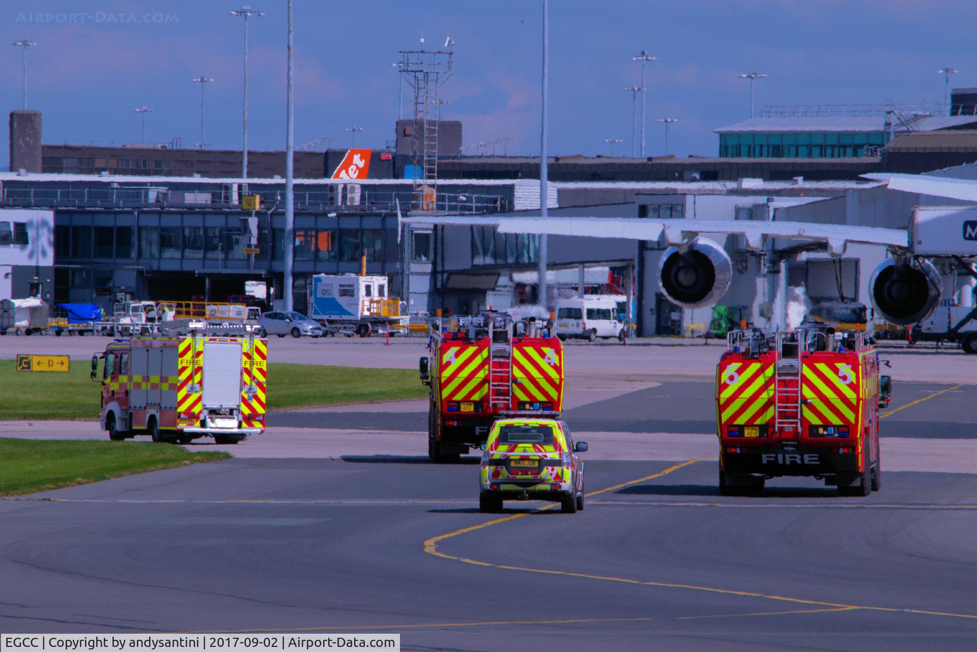 Manchester Airport, Manchester, England United Kingdom (EGCC) - fire trucks following G-JECY bee 