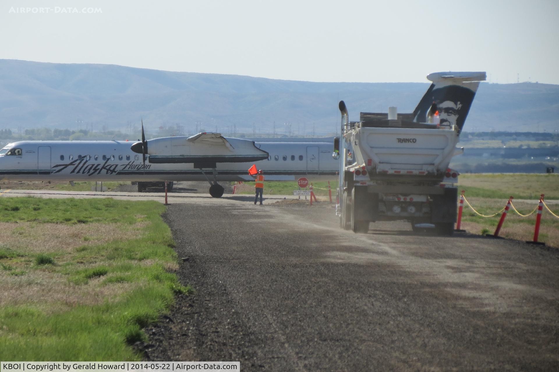 Boise Air Terminal/gowen Fld Airport (BOI) - Flagman at work stopping trucks during construction in May 2014.