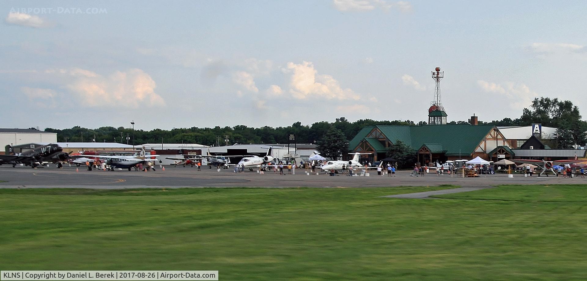 Lancaster Airport (LNS) - View of the terminal and ramp from an airplane during the annual airshow.