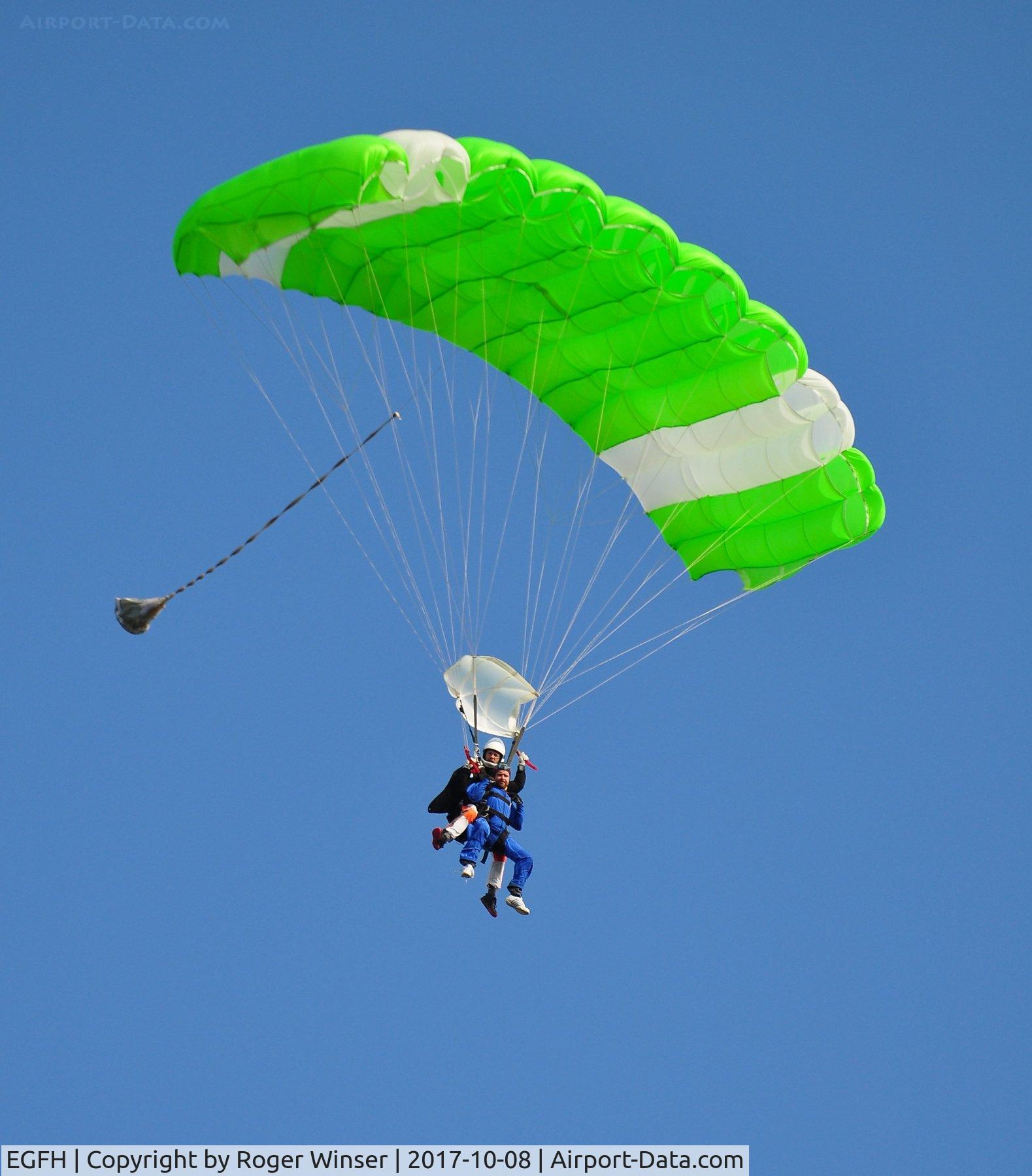Swansea Airport, Swansea, Wales United Kingdom (EGFH) - Tandem skydivers from Skydive Swansea about to drop on the Northern PLA.