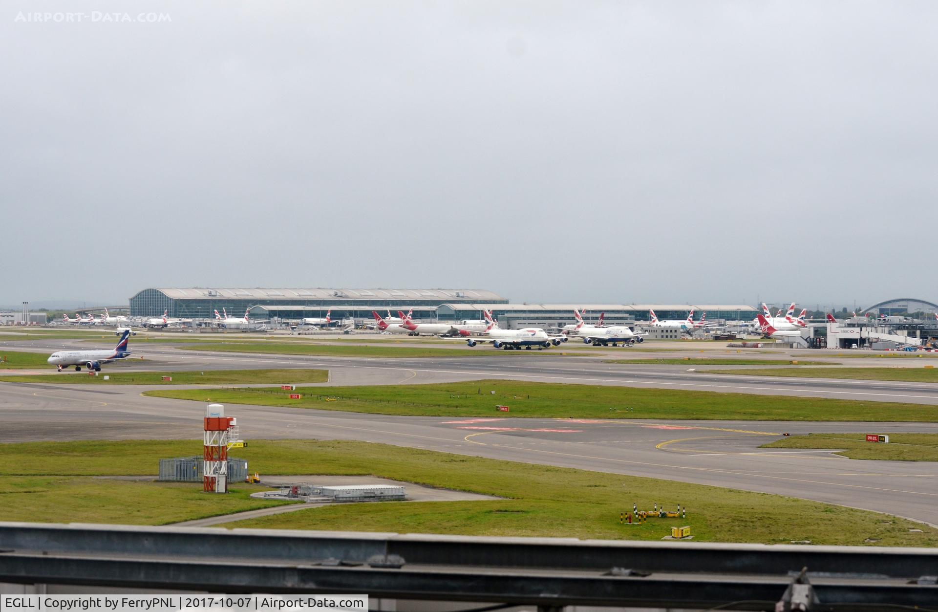 London Heathrow Airport, London, England United Kingdom (EGLL) - View toward Terminal 5 in the distance with part of T3 to the right.