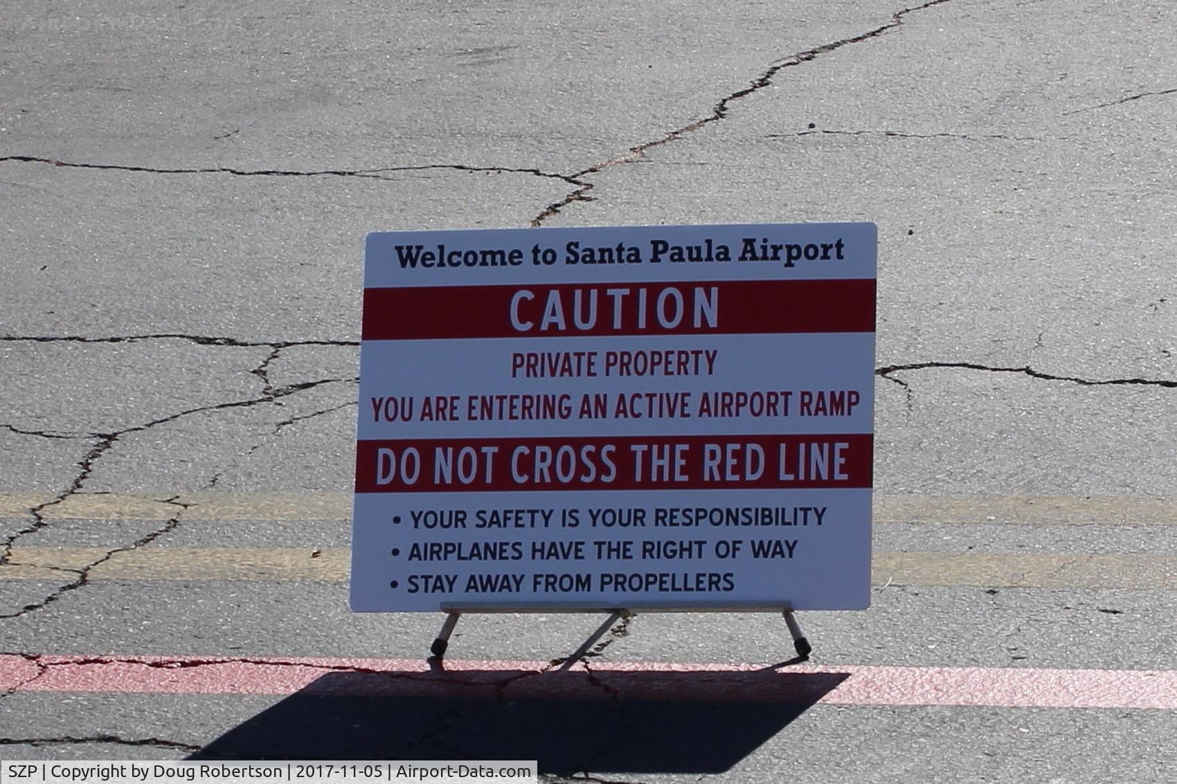 Santa Paula Airport (SZP) - Airport Caution Sign near Rwy 22/04 taxiway midfield Fuel Dock area