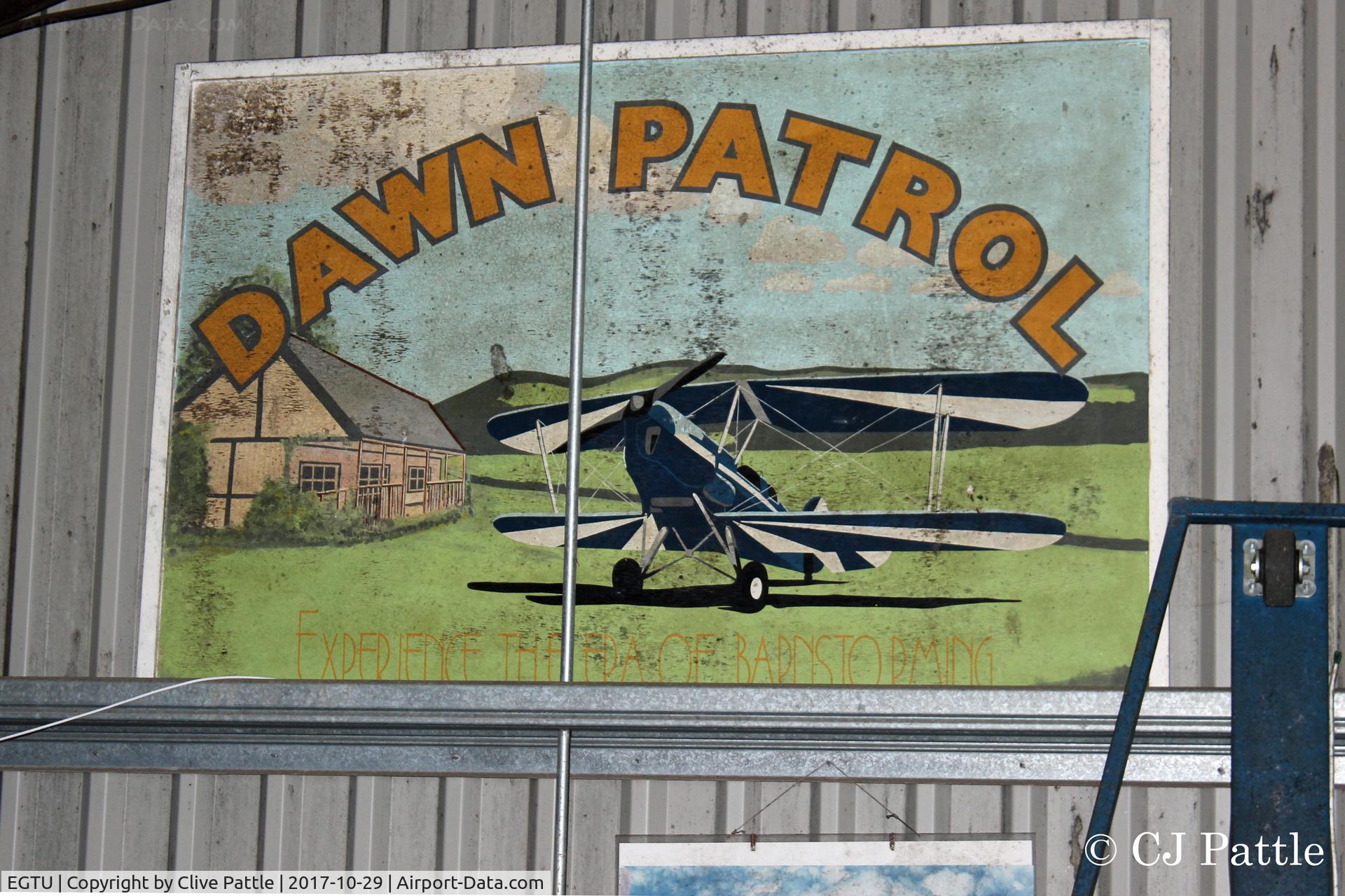 Dunkeswell Aerodrome Airport, Honiton, England United Kingdom (EGTU) - Some artwork hanging in a hangar at Dunkeswell, don't know if there is any age to it owing to the fairly modern looking aircraft - but it does mention Barnstorming !