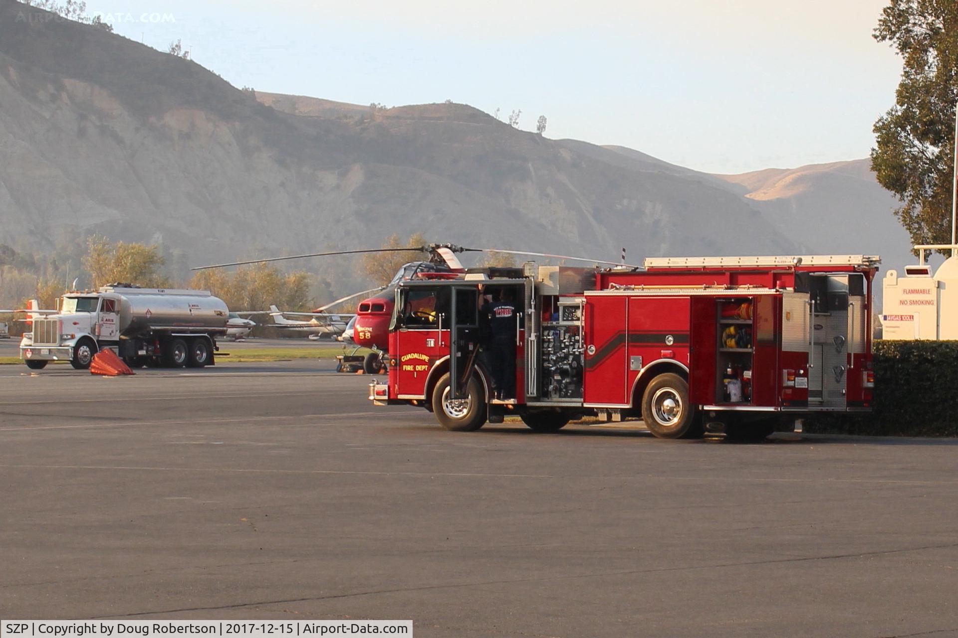 Santa Paula Airport (SZP) - Guadalupe Fire Department manned truck on duty at SZP  airport backing up the Thomas Fire fighting helicopters