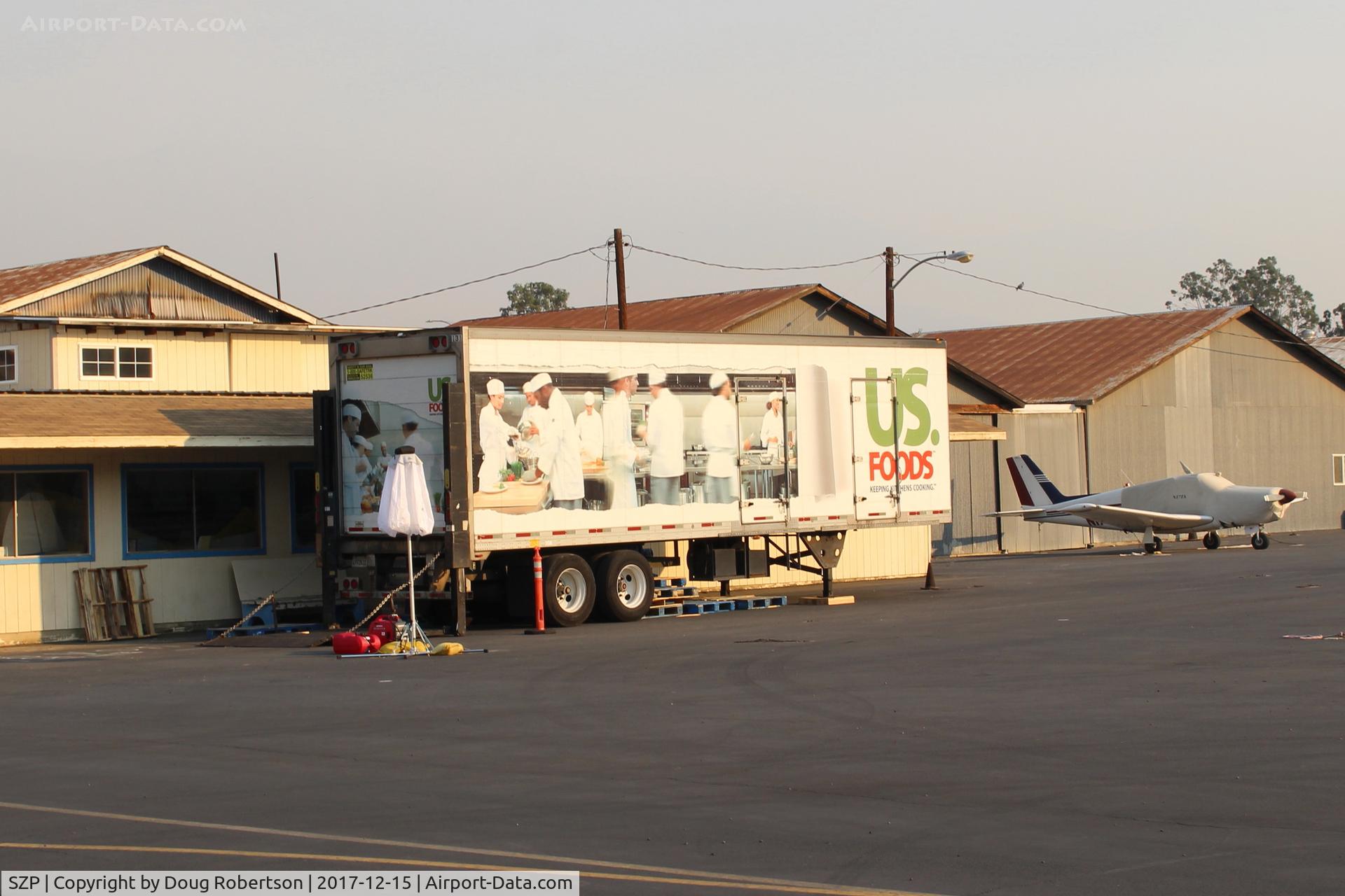 Santa Paula Airport (SZP) - Thomas Fire Airborne Firefighters need to be fed-this semi-trailer is the Food source. Smoky sky above and beyond.