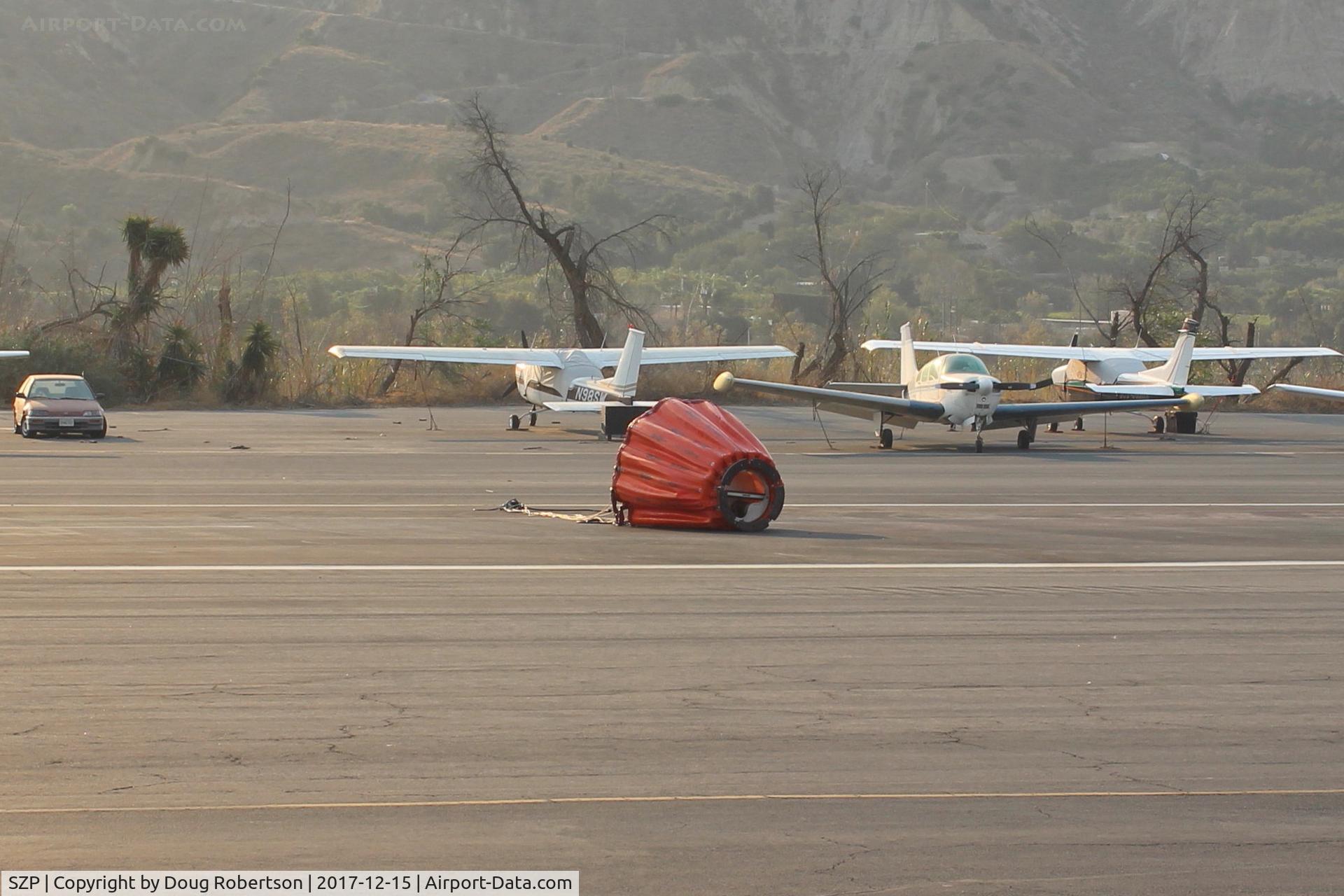 Santa Paula Airport (SZP) - Typical Fire Suppression load-drop bucket left on the duty runway from a FireFighter helicopter-at the Thomas FireBase