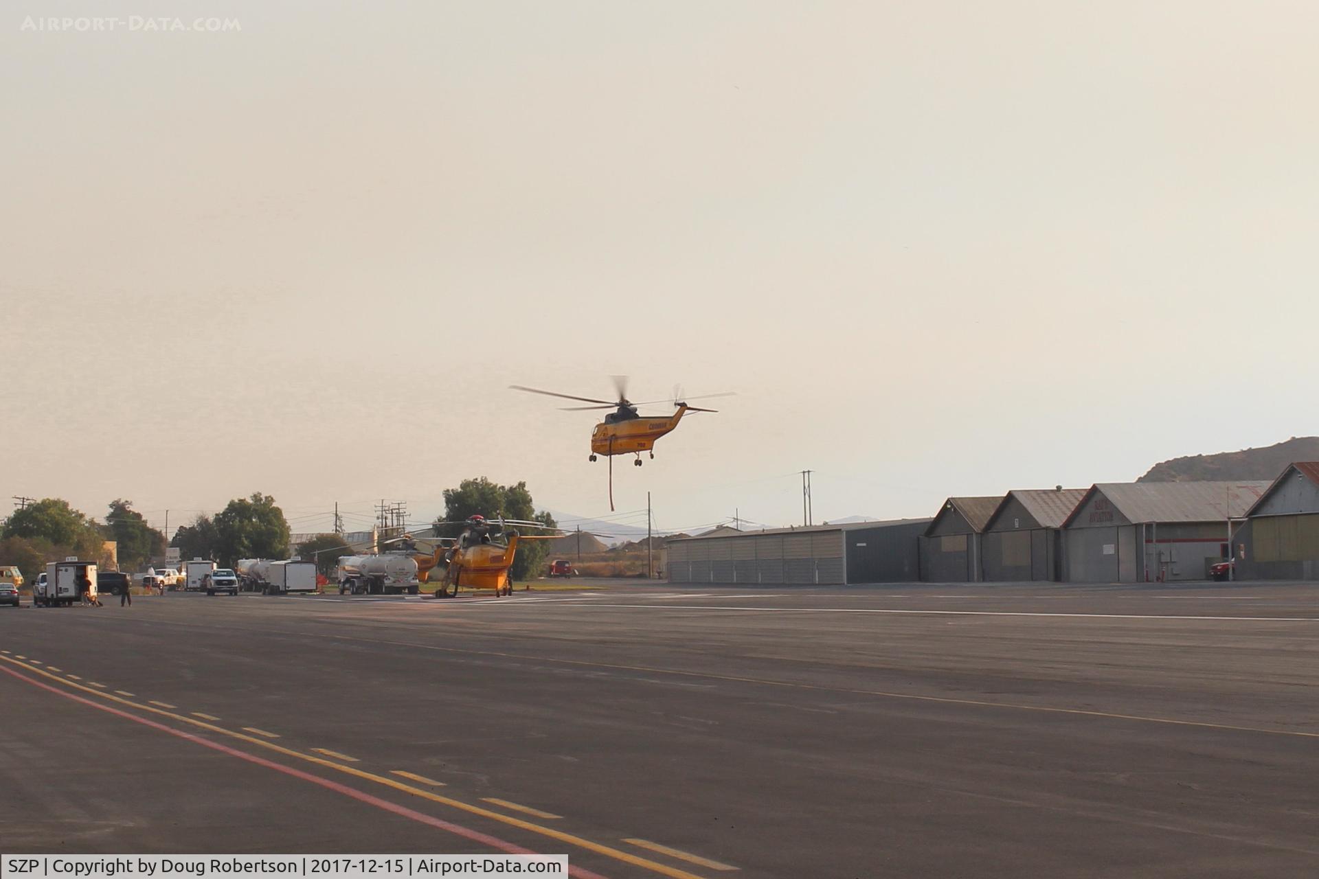 Santa Paula Airport (SZP) - Takeoff hover of a Thomas Fire FireBomber into a smoky sky.