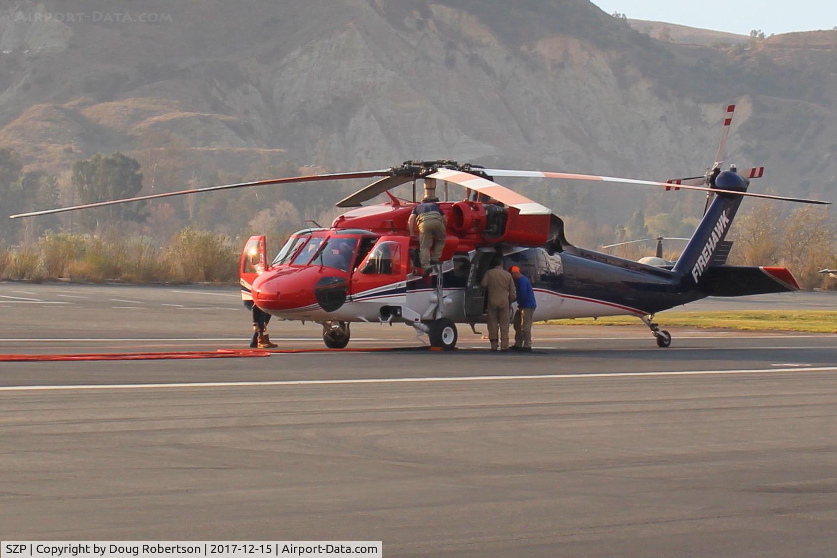 Santa Paula Airport (SZP) - Preparing this FireBomber for another sortie-The Thomas Fire.