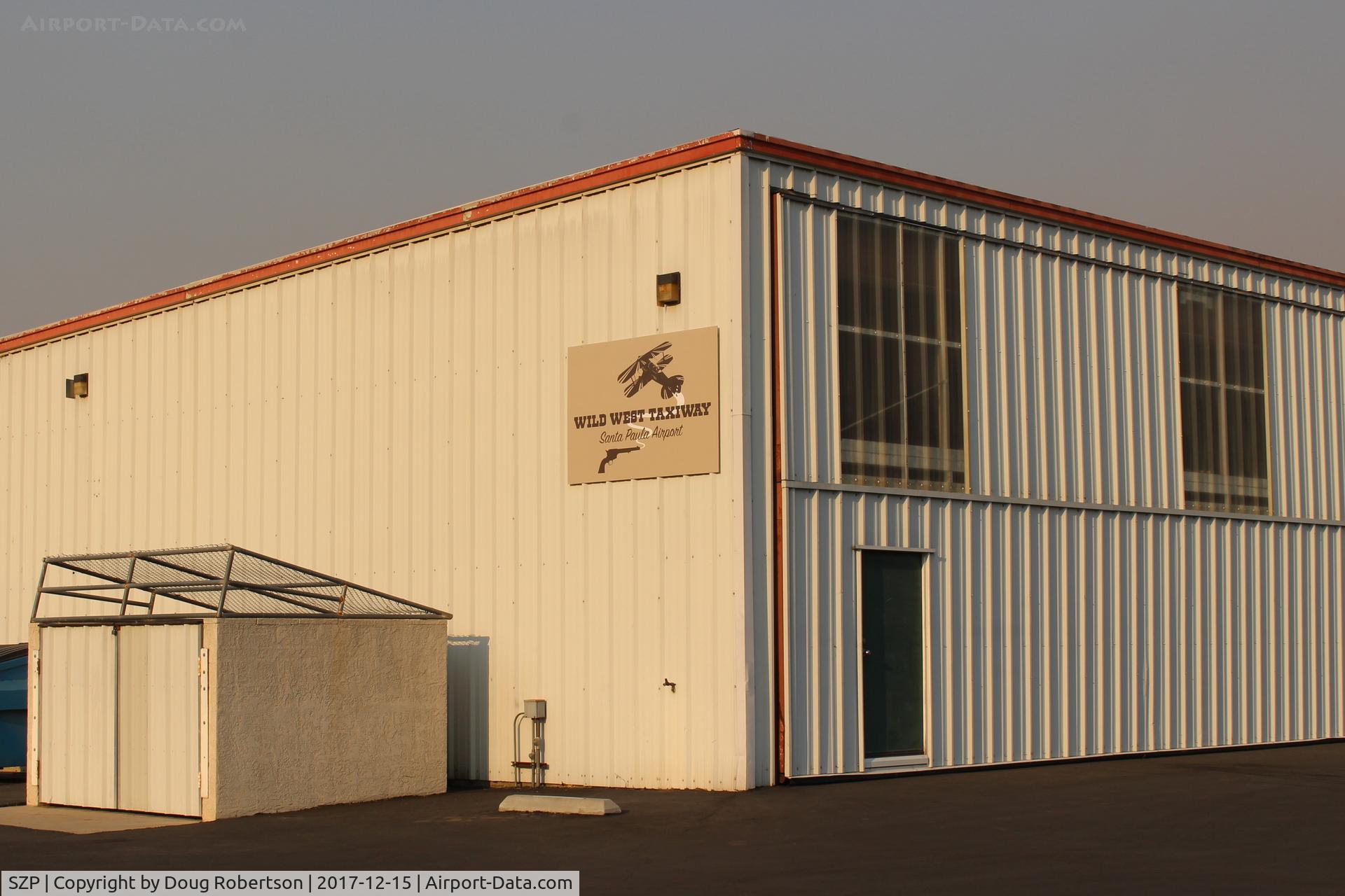 Santa Paula Airport (SZP) - New signage at the far-west end of the airport; technically, these comparatively newer rows of deluxe hangars are off-airport and pay an annual taxi fee. 