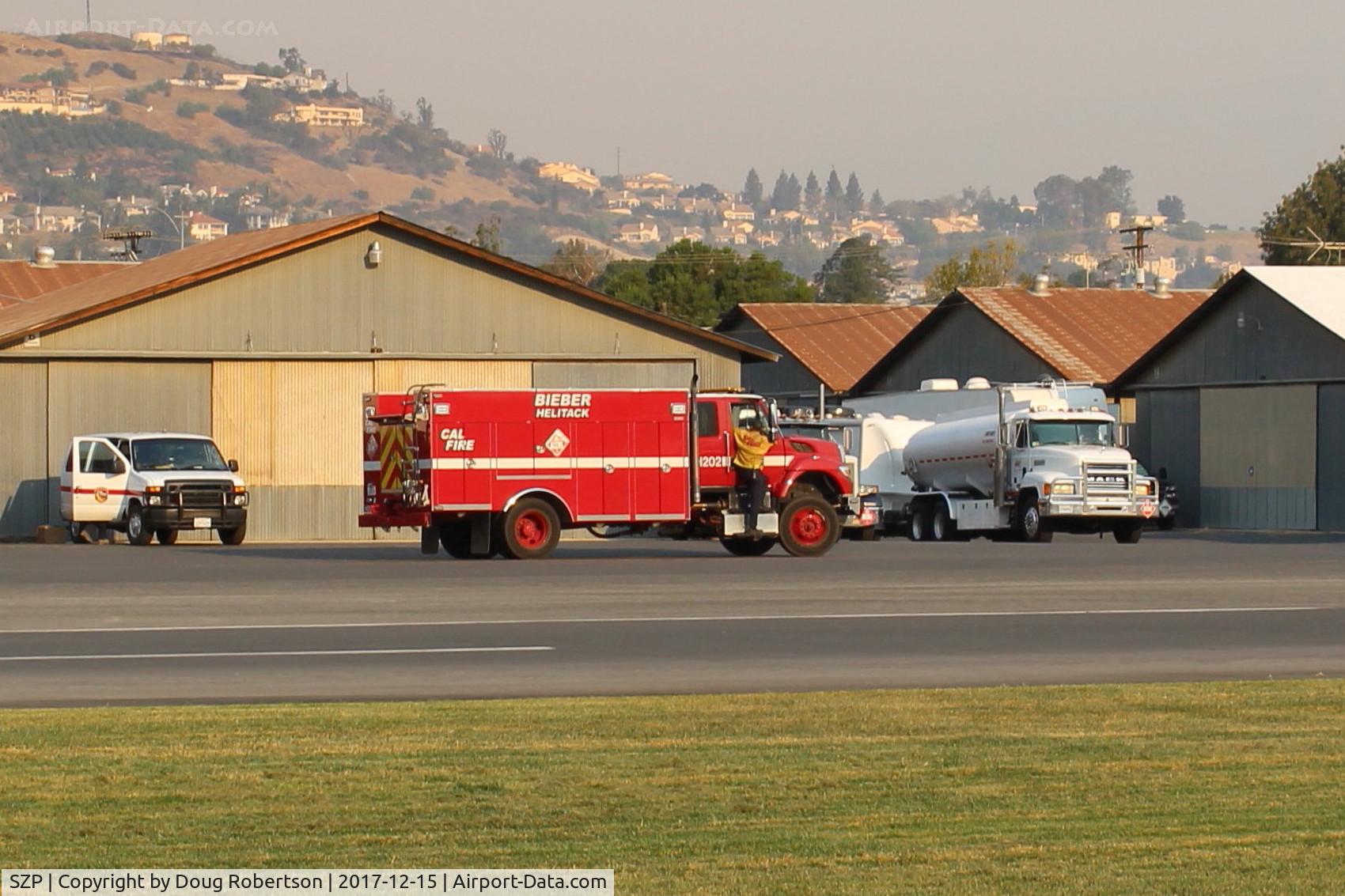 Santa Paula Airport (SZP) - CAL-FIRE contract support vehicle and fuel tankers in support of fighting the Thomas Fire-note smoky sky
