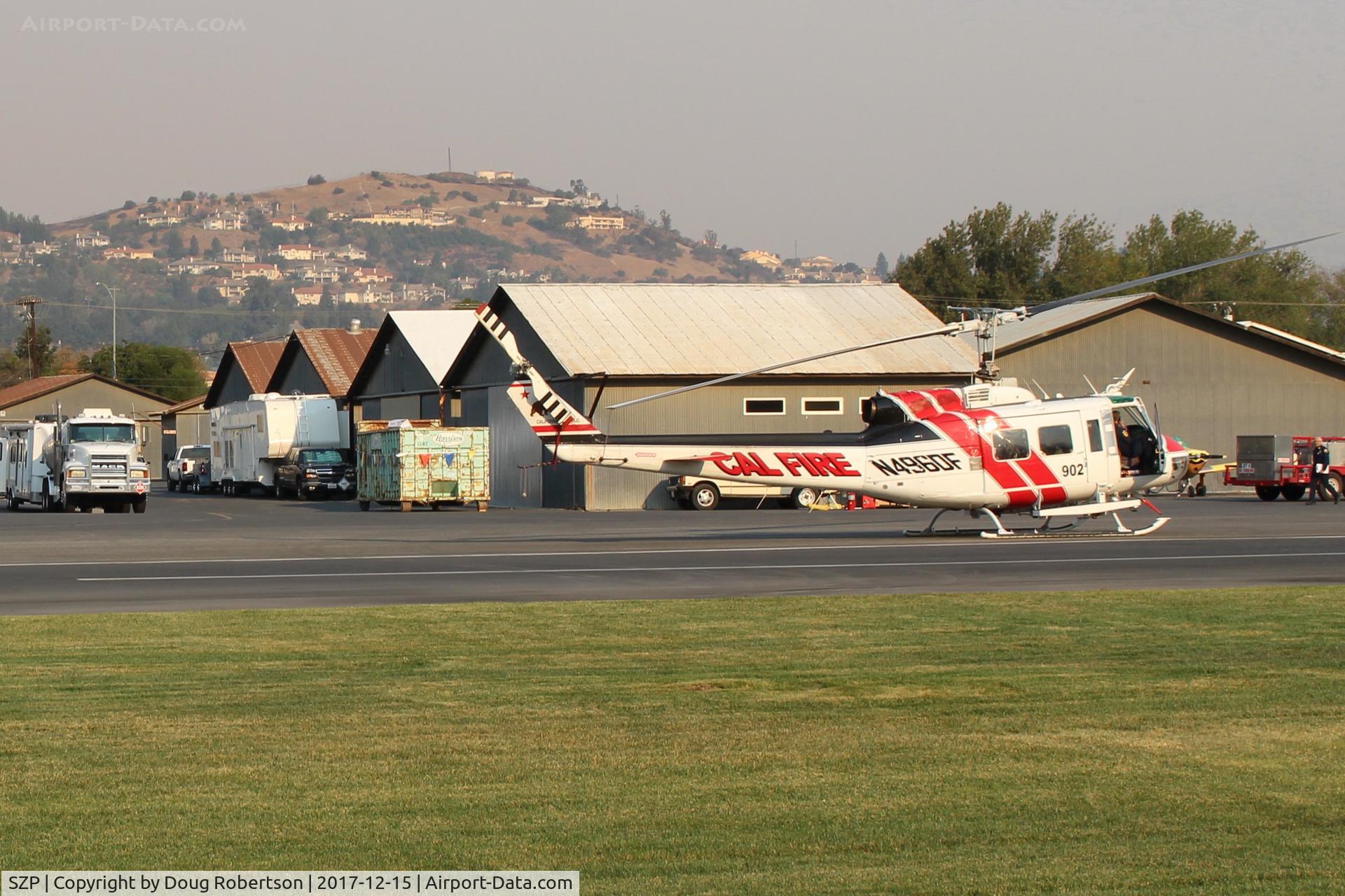 Santa Paula Airport (SZP) - N496DF 1969 Bell EH-!H IROQUOIS, (CAL FIRE 902) Government USDA Forest Service. Note smoky sky, at SZP FireBase