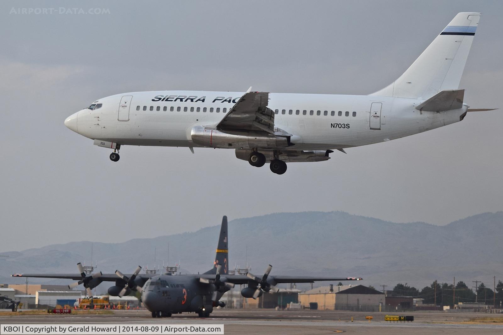 Boise Air Terminal/gowen Fld Airport (BOI) - Landing RWY 28L, Sierra Pacific has contract with NIFC to transport fire crews where needed. C-130 from the 153rd AW awaiting clearance to fly a fire suppression mission.