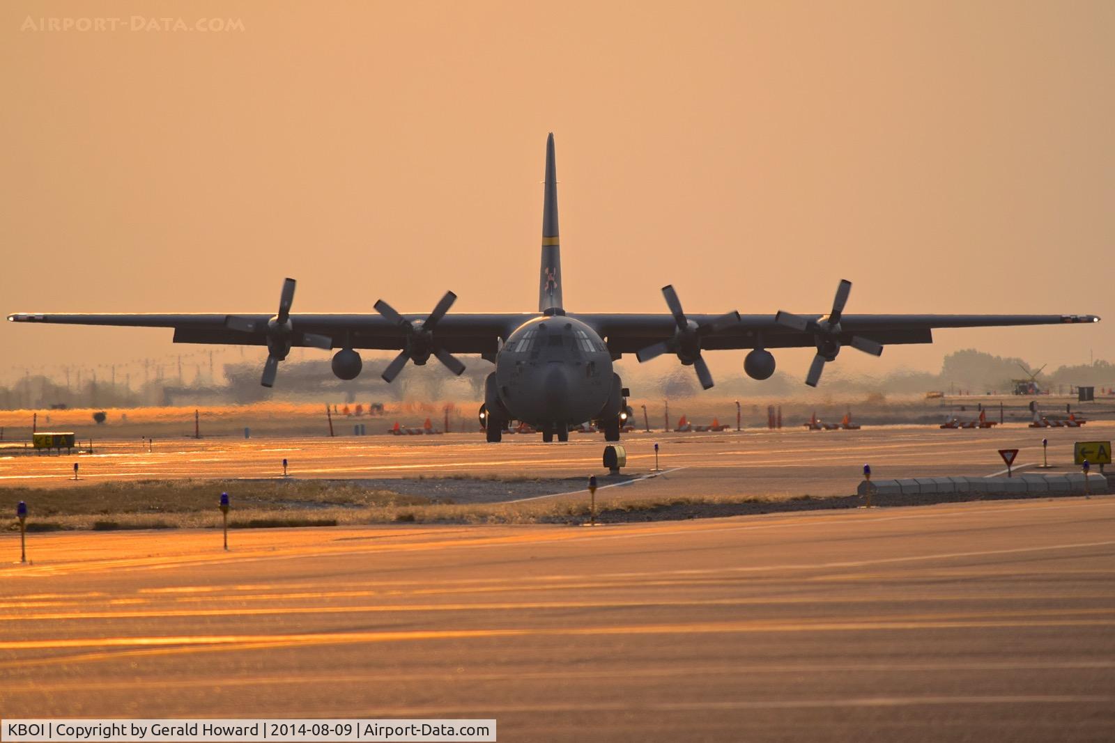 Boise Air Terminal/gowen Fld Airport (BOI) - C-130h from the 153rd AW returning from a fire mission at dusk.