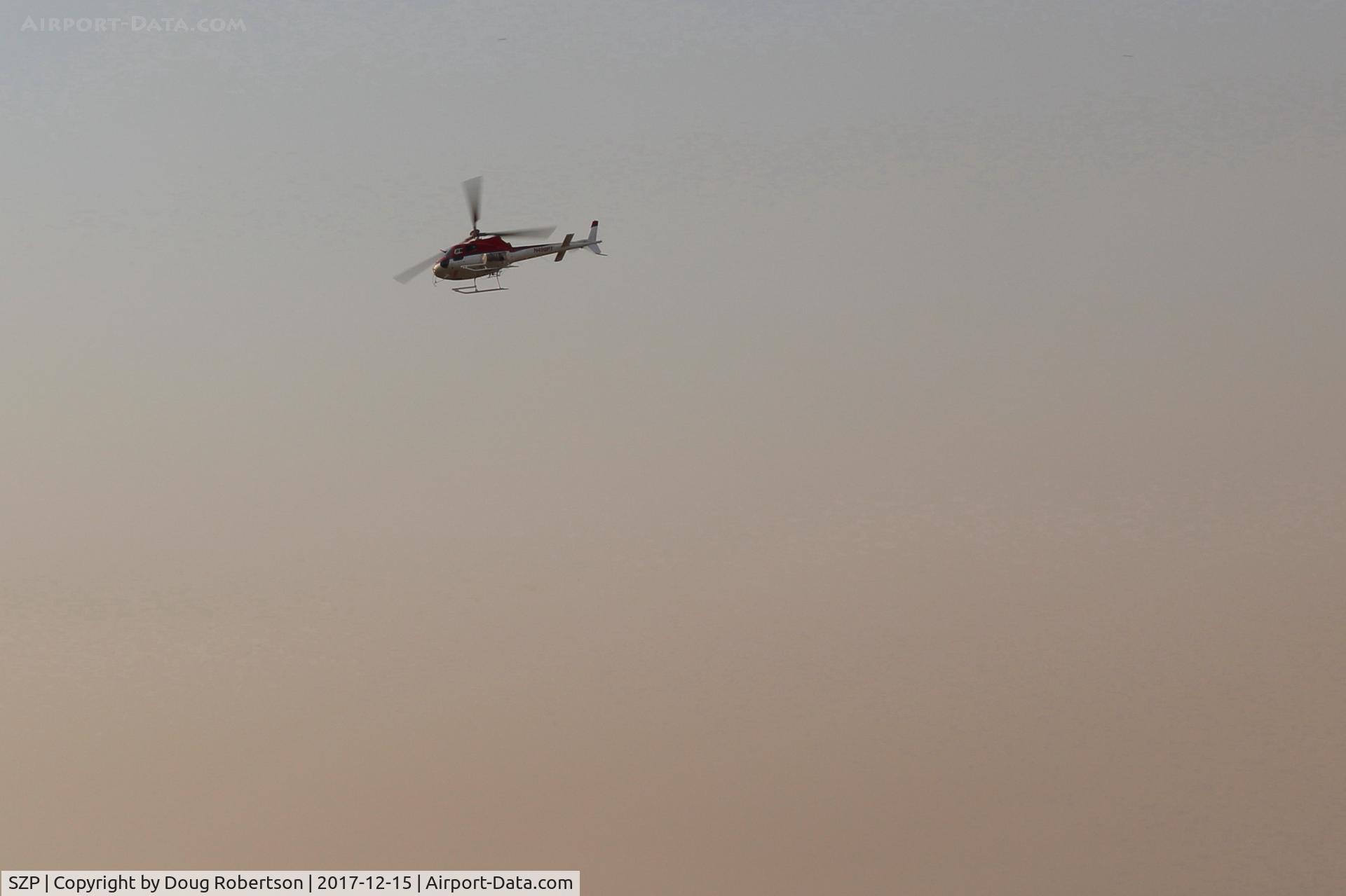 Santa Paula Airport (SZP) - Unknown fire bomber support overhead SZP Thomas Fire firebase in smoky skies