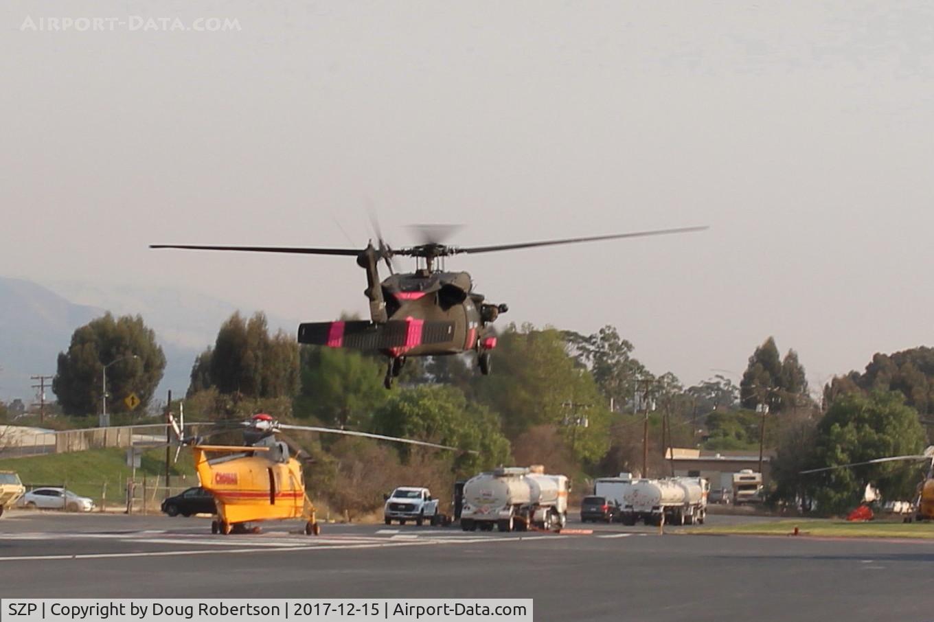 Santa Paula Airport (SZP) - Inbound FireBomber to land SZP Firebase, no registration markings. Note smoky sky.