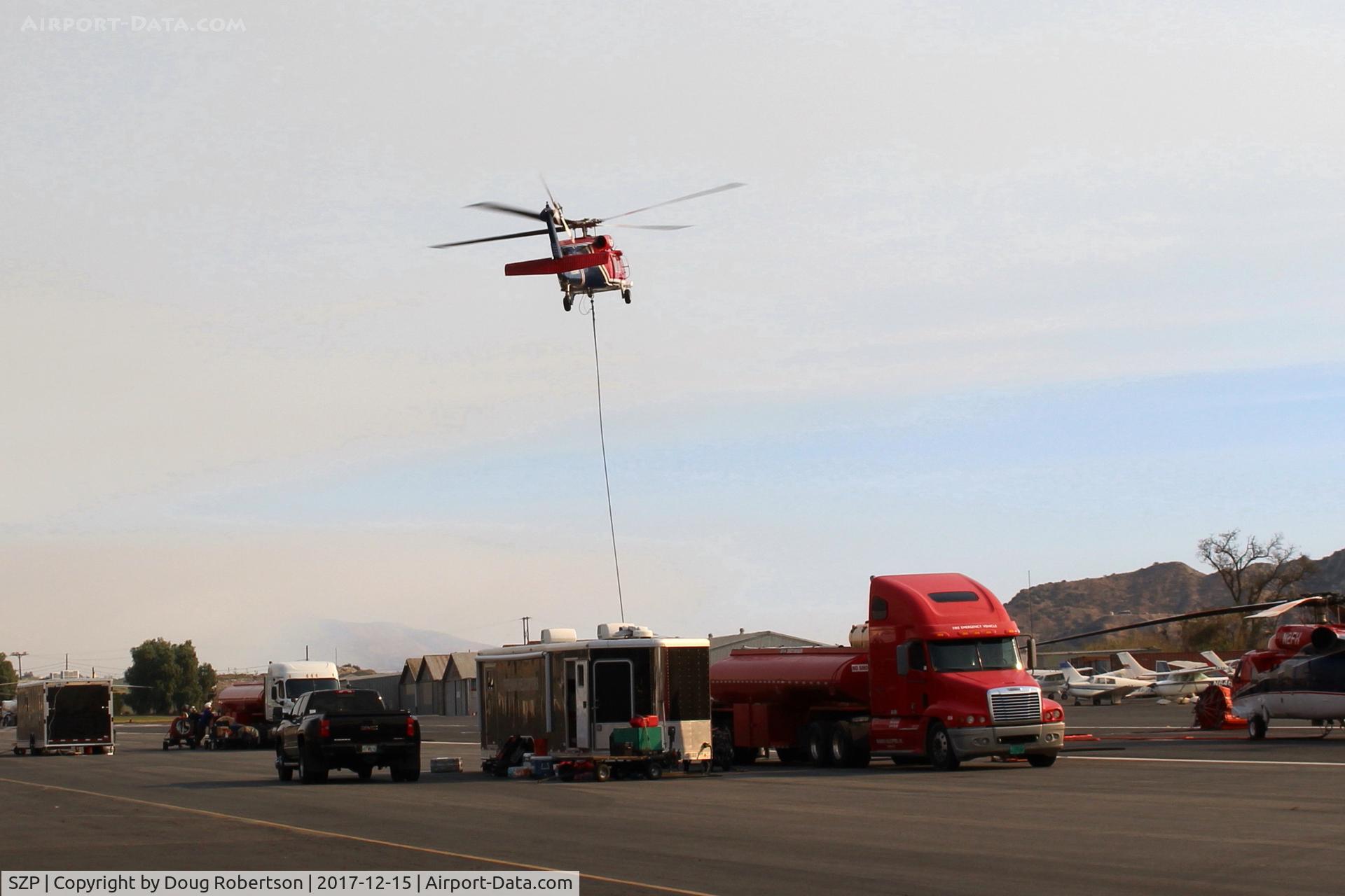 Santa Paula Airport (SZP) - N135BH 1987 Sikorsky S-70A-27 FIREHAWK, GE-T700 Series, firebomber lifting off SZP FireBase to fight Thomas Fire