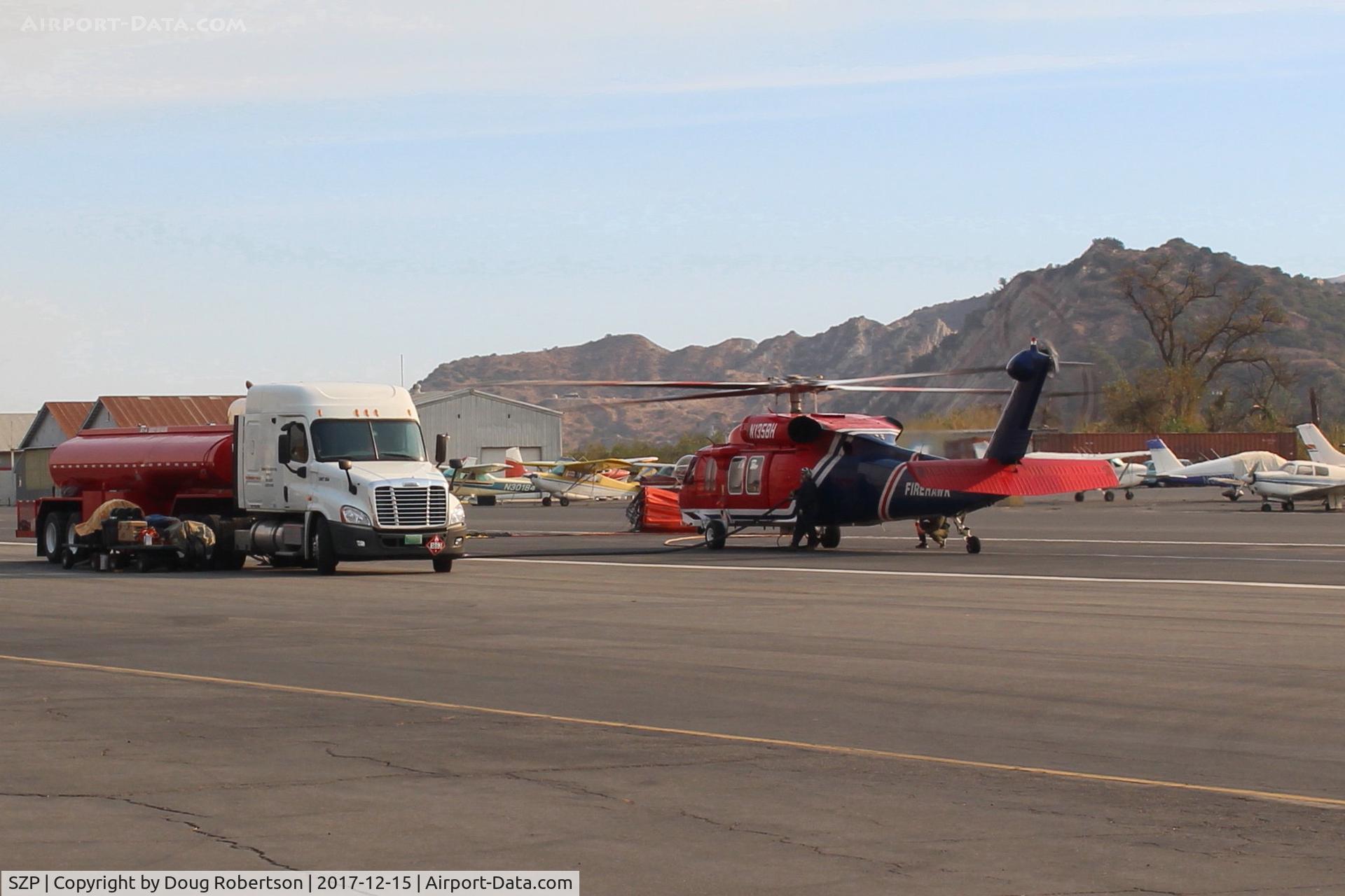 Santa Paula Airport (SZP) - N135BH 1987 Sikorsky FIREHAWK S-70A-27, GE T700 Series, Restricted class firebomber, at SZP Fire Base with associated support gear