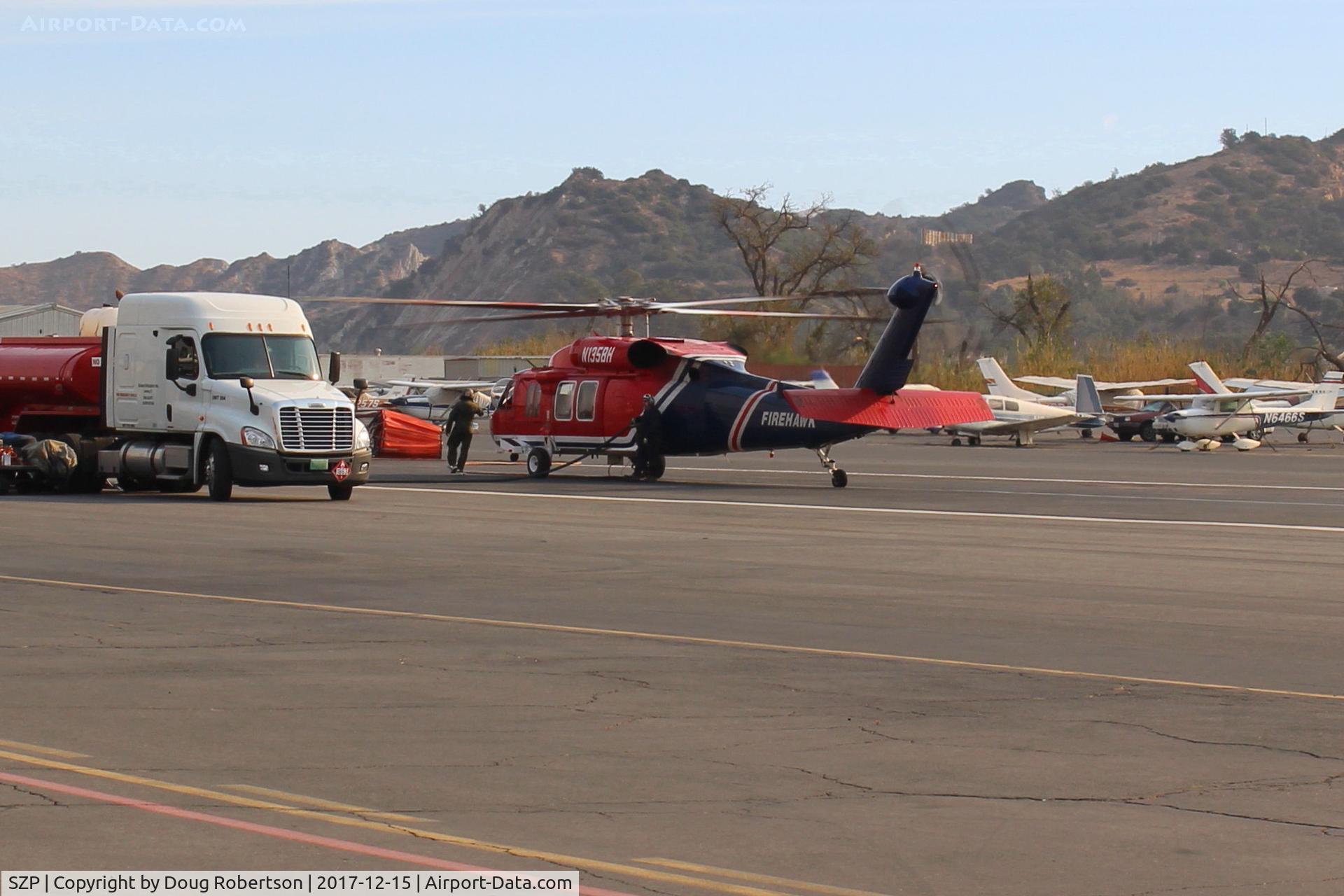 Santa Paula Airport (SZP) - N135BH 1987 Sikorsky FIREHAWK S-70A-27 GE T700 Series, Restricted class, readying for firebomb action, at SZP  Thomas fire FireBase.