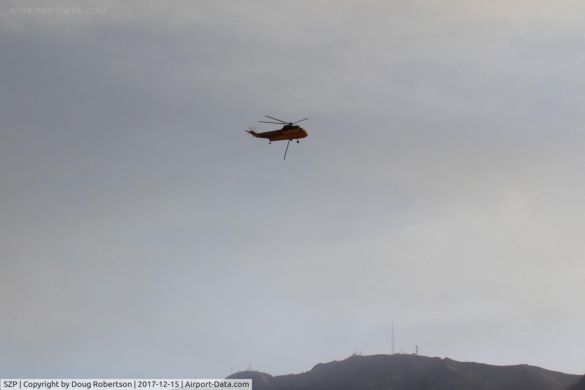 Santa Paula Airport (SZP) - CROMAN helicopter with Phos Chek sling load dumped, returning to SZP Firebase