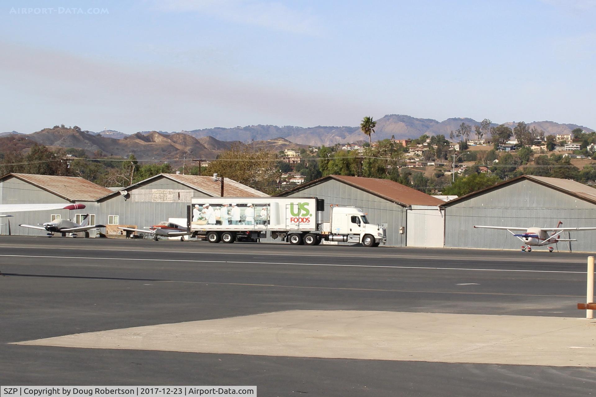 Santa Paula Airport (SZP) - SZP Thomas FireBase Firefighter's Food Support Truck-last vestige of FireBase Support moving to depart SZP. Note smoky skies from the fire still spreading.