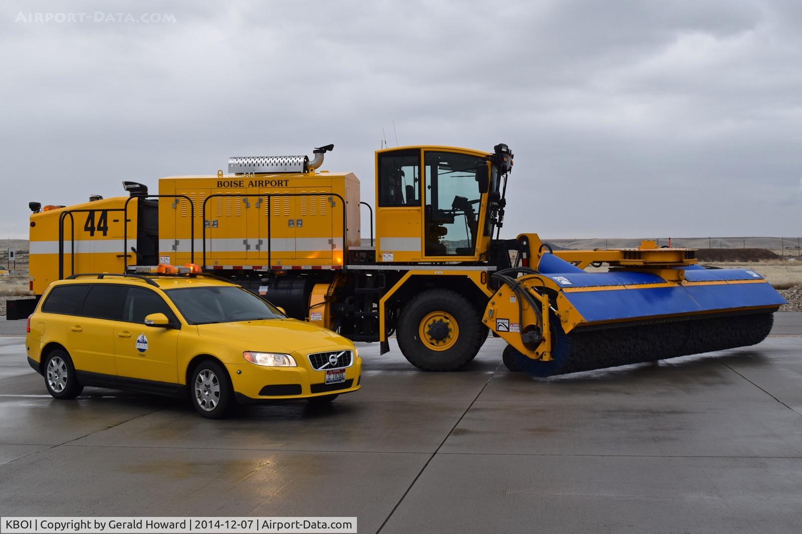Boise Air Terminal/gowen Fld Airport (BOI) - The Volvo friction tester beside a new sweeper/blower combo in one truck.