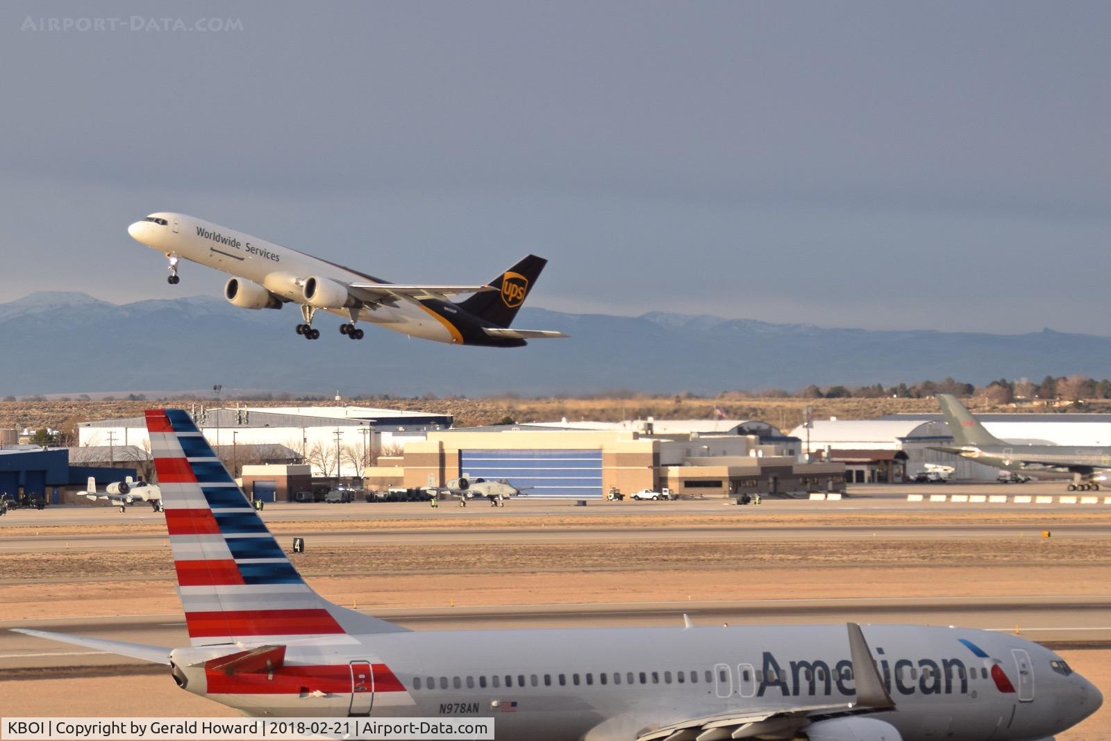 Boise Air Terminal/gowen Fld Airport (BOI) - UPS departing RWY 10R while American taxies to RWY 10L.