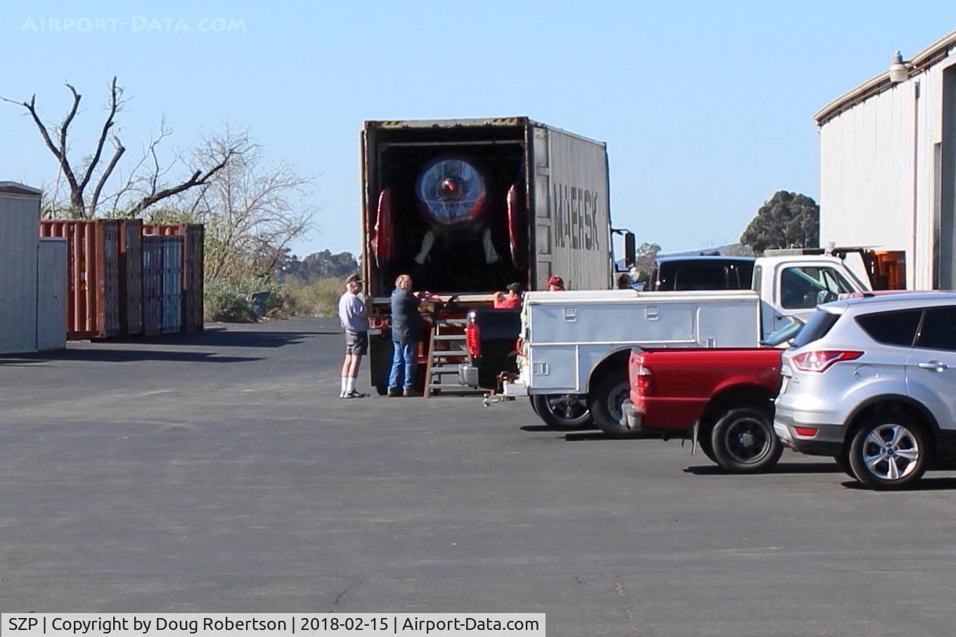 Santa Paula Airport (SZP) - MAERSK LINE arrival truck to unload Kimball PITTS Model 12 biplane aircraft for reassembly. Maersk  is largest international shipper using ocean freighters. Location-behind Ray's Aviation. Some ocean freight containers in left side past Tee Hangar.