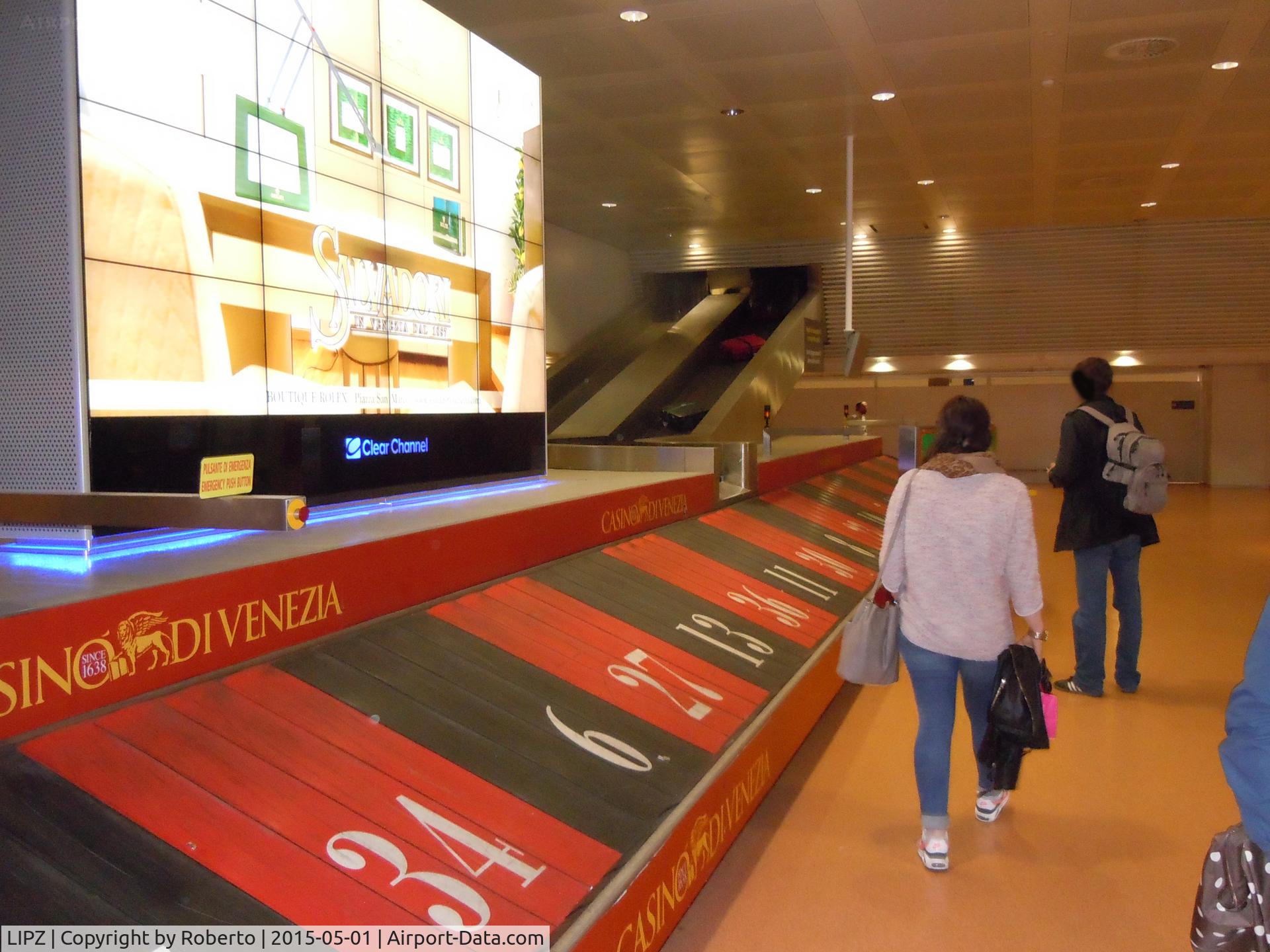 Marco Polo International Airport (Marco Polo Venice Airport), Venice (Venezia) Italy (LIPZ) - The luggage carousel in CASINO colors.